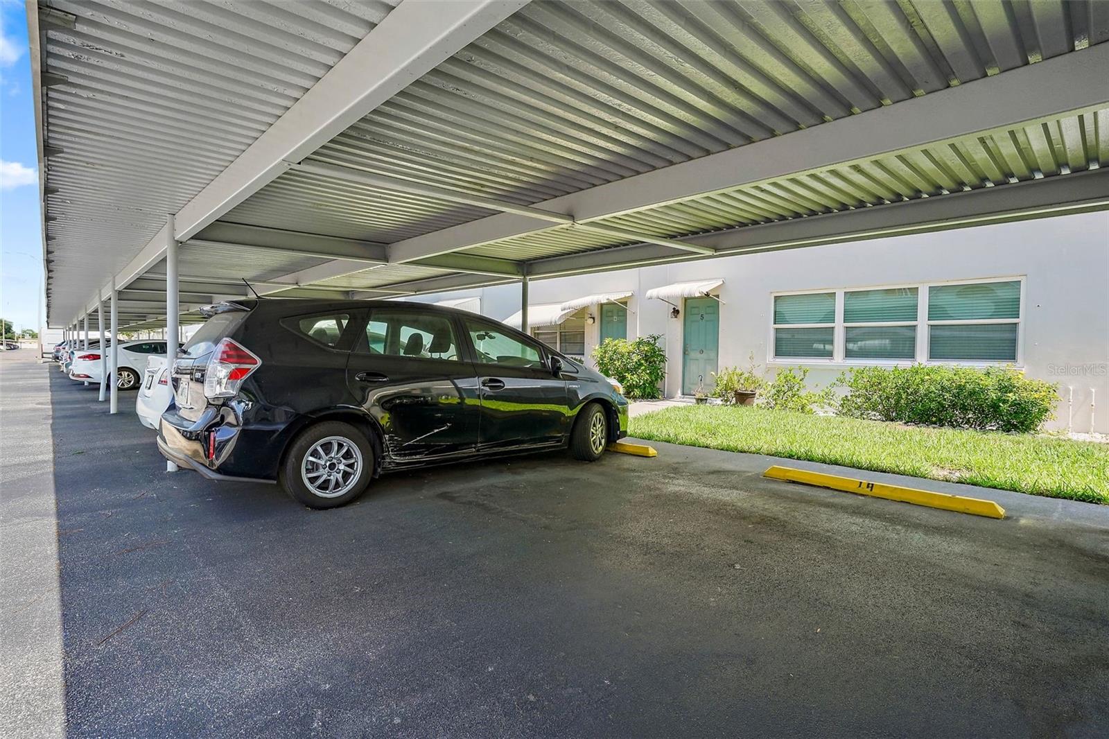 Covered parking space directly behind the unit