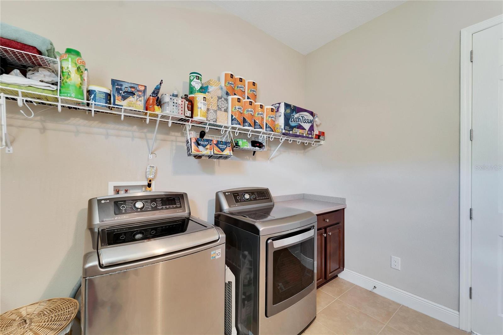 Oversized laundry room , extra shelving and dedicated counter space