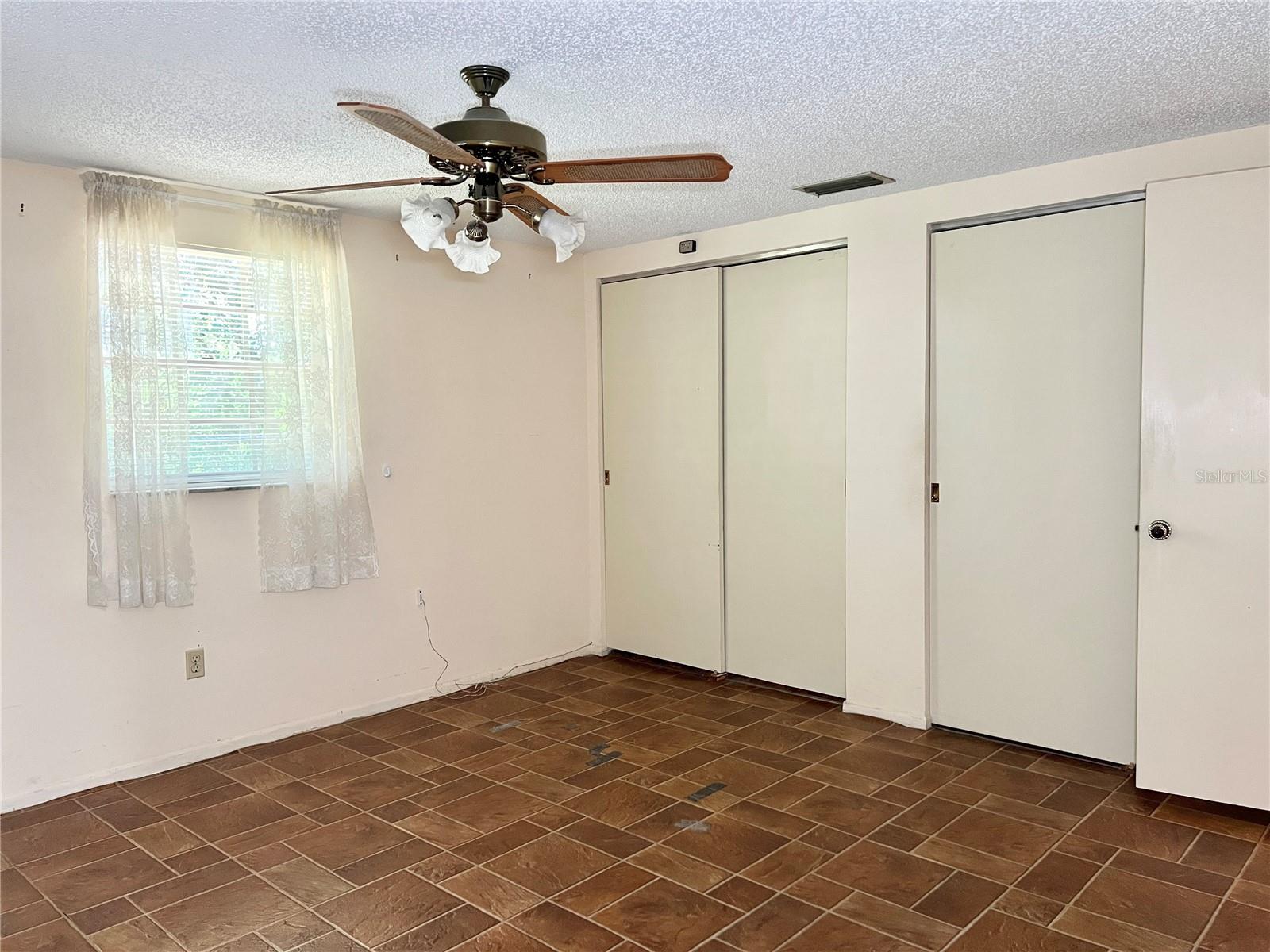 Primary Bedroom - Double Closets and Ceiling Fans