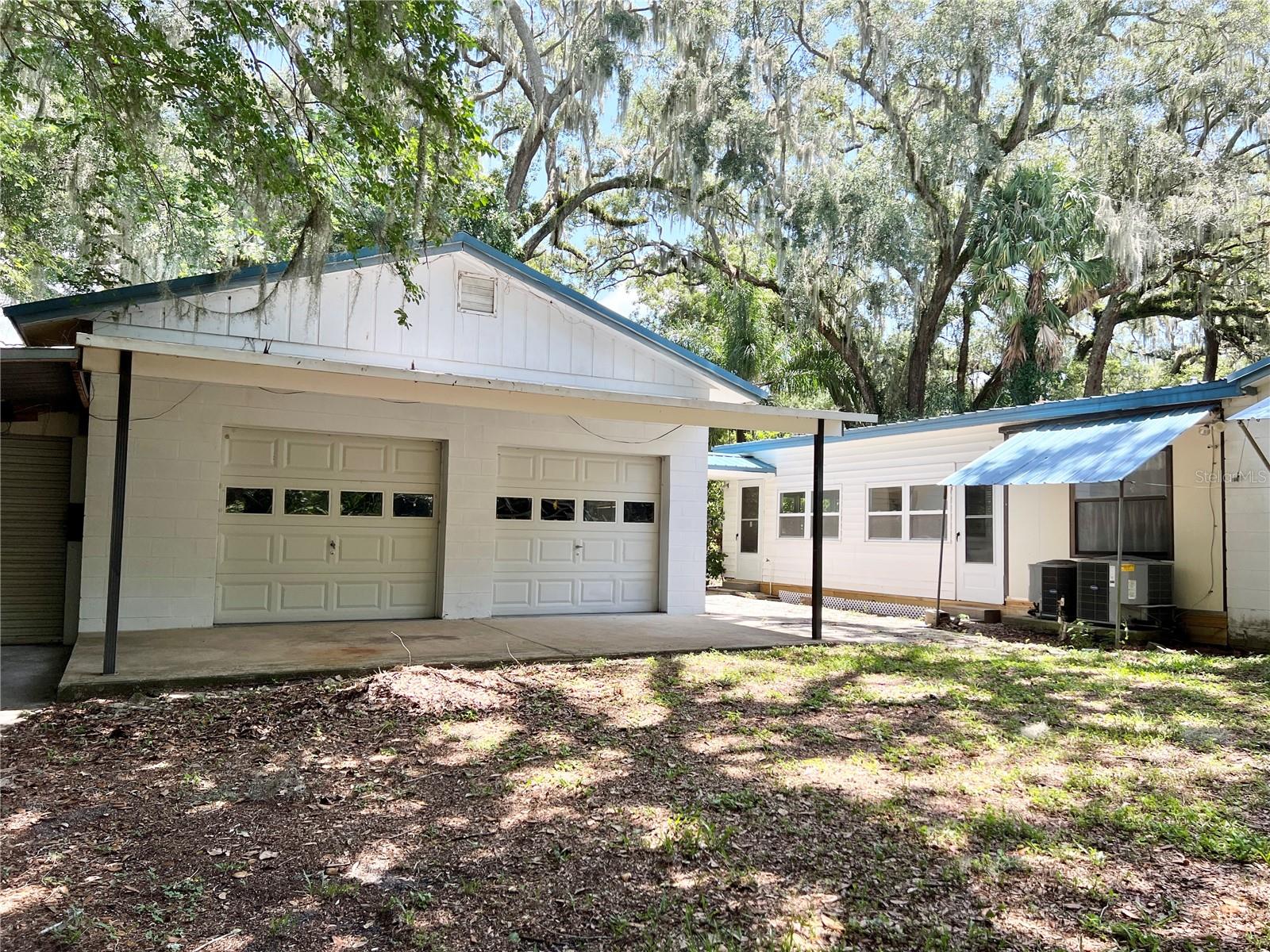 Two Car Garage - Additional Opened Covered Areas on Side and Back