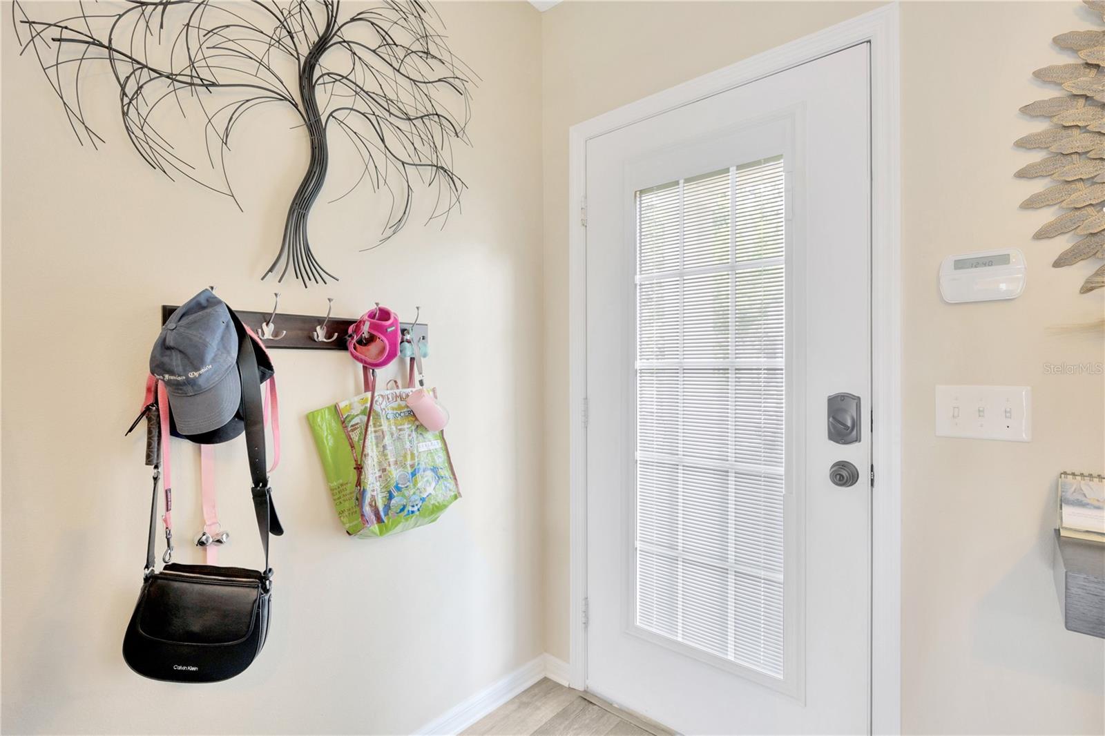 front door that adds natural light with built in blind