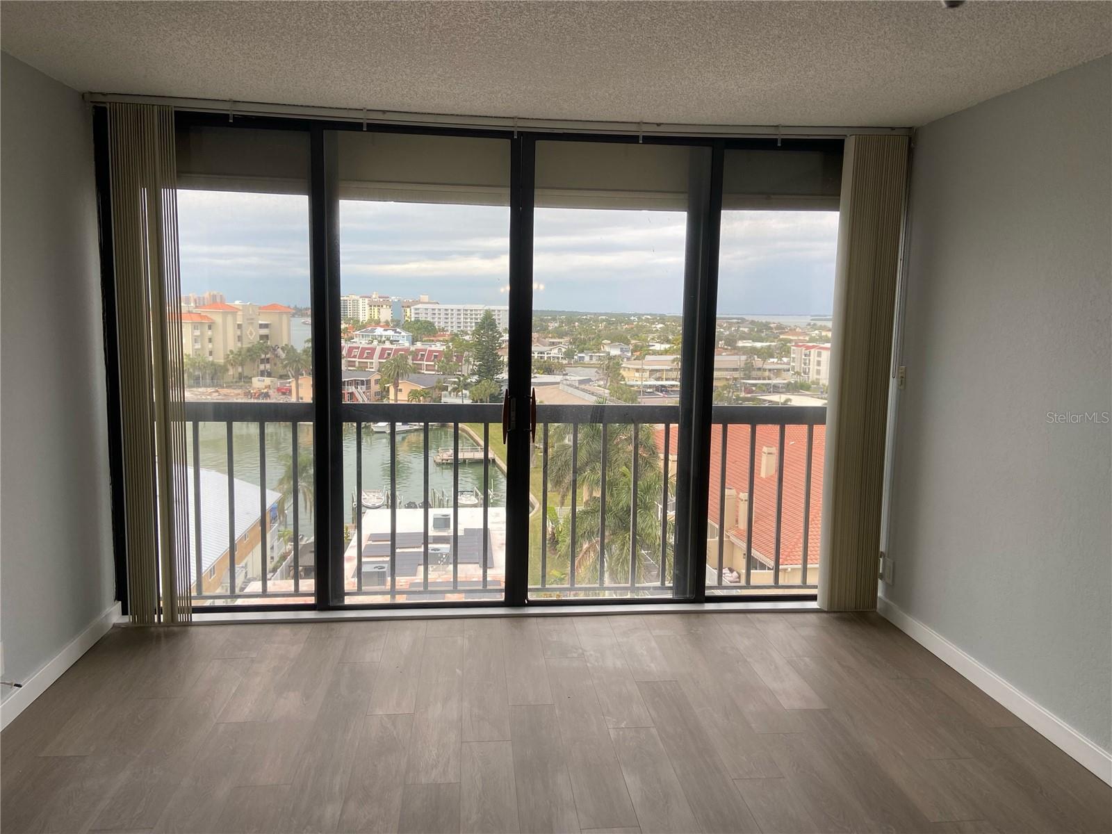 Living room with large sliders and water views