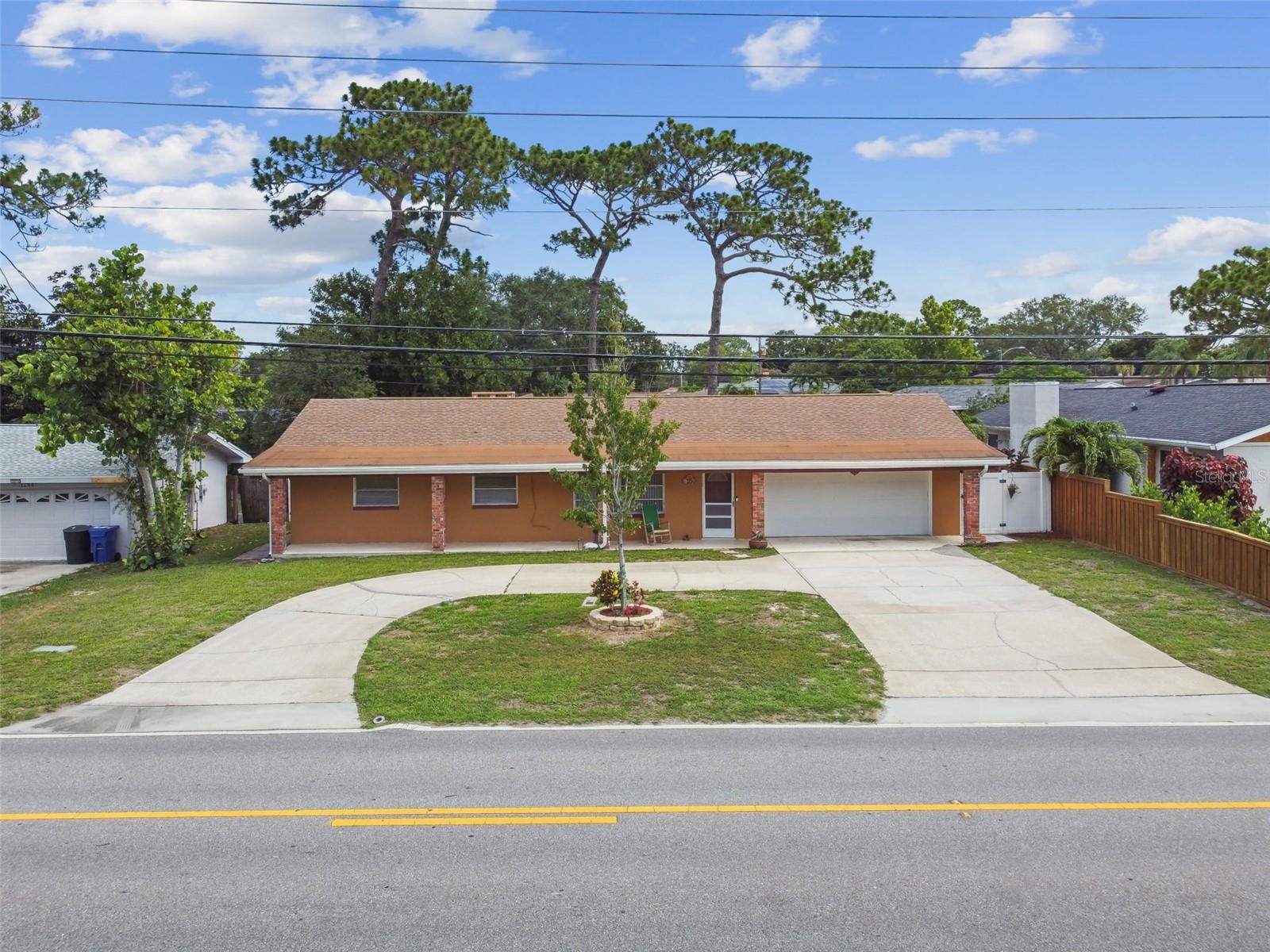 Front Exterior with large horseshoe driveway