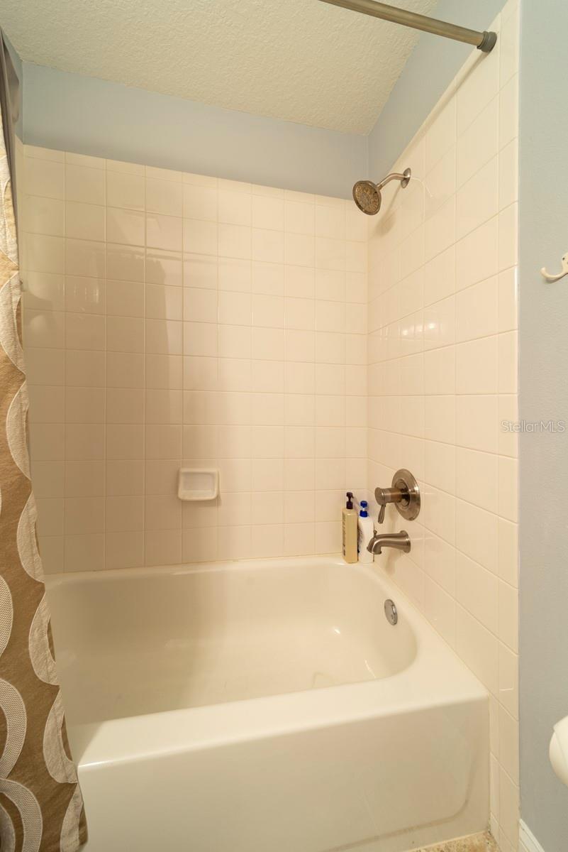 ensuite bath has shower tub combo