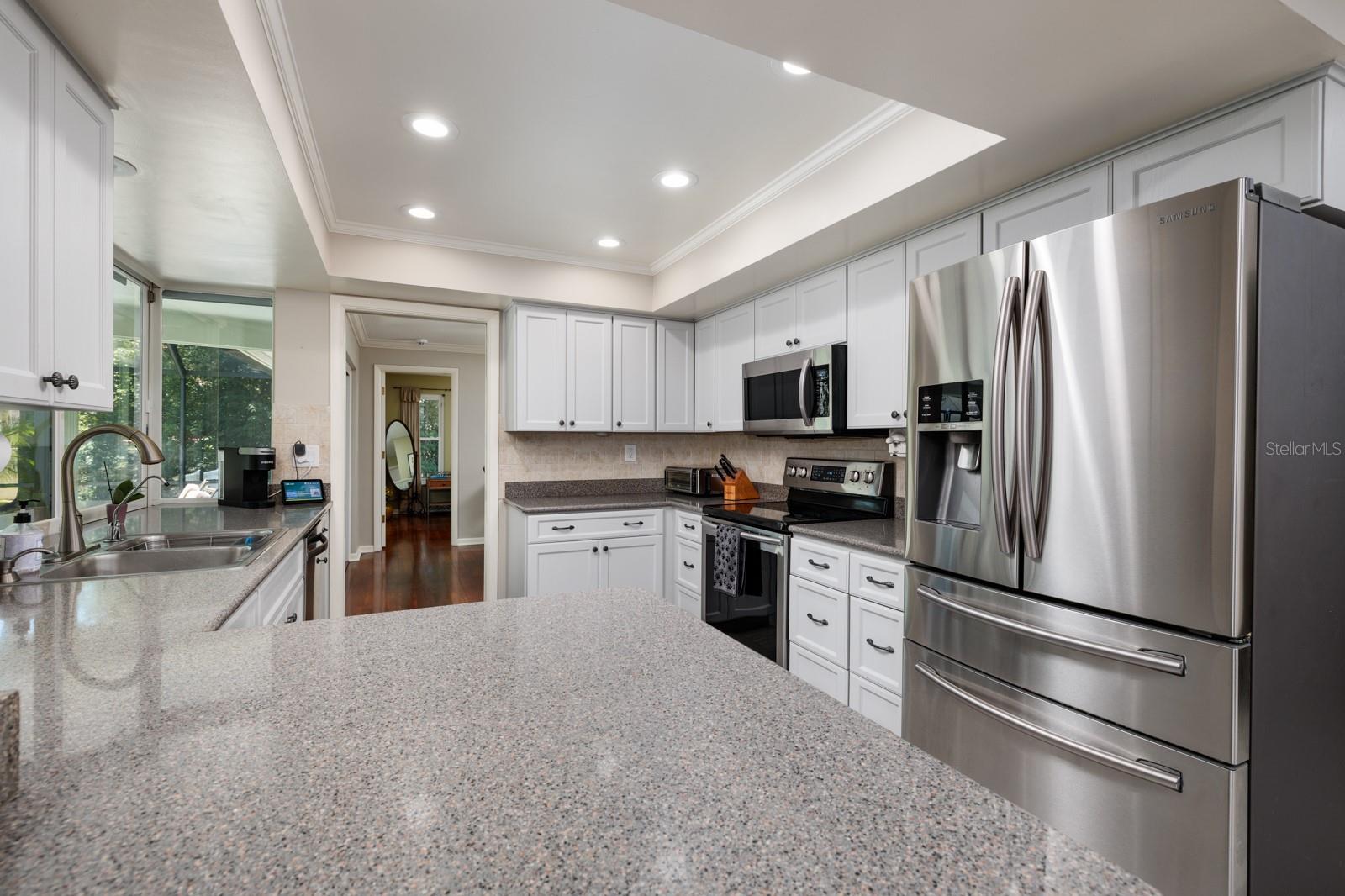 Kitchen with full length granite countertop.