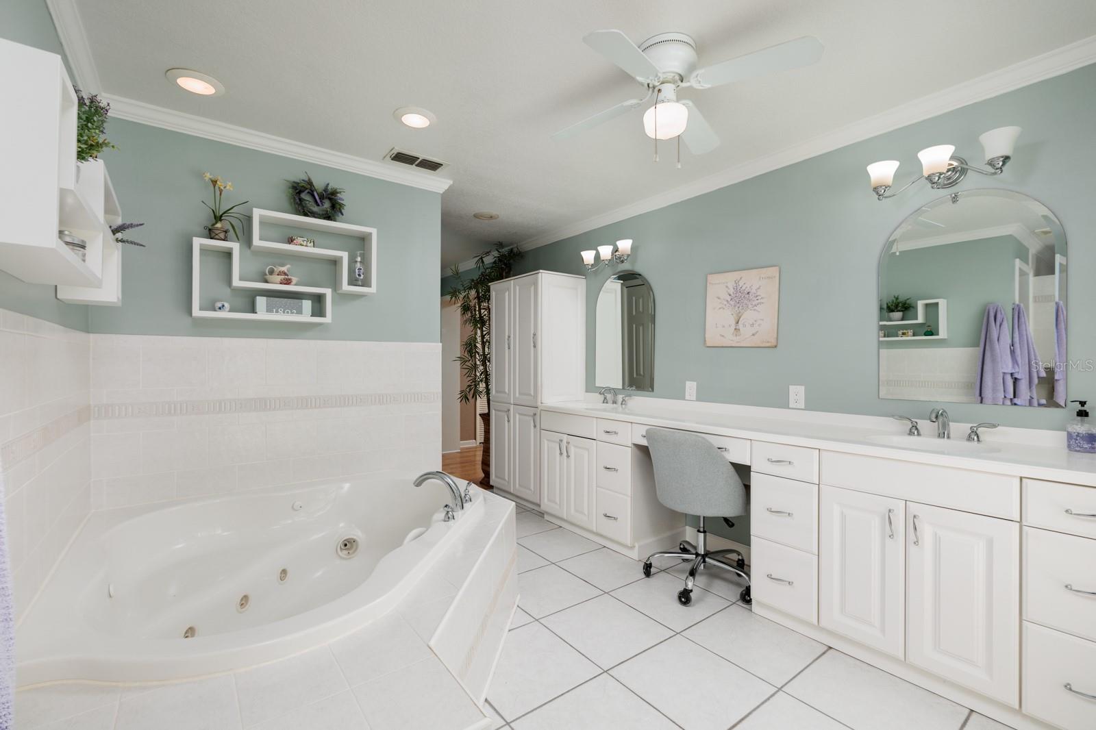 Primary Bath with extra long 2 sink vanity with makeup area.