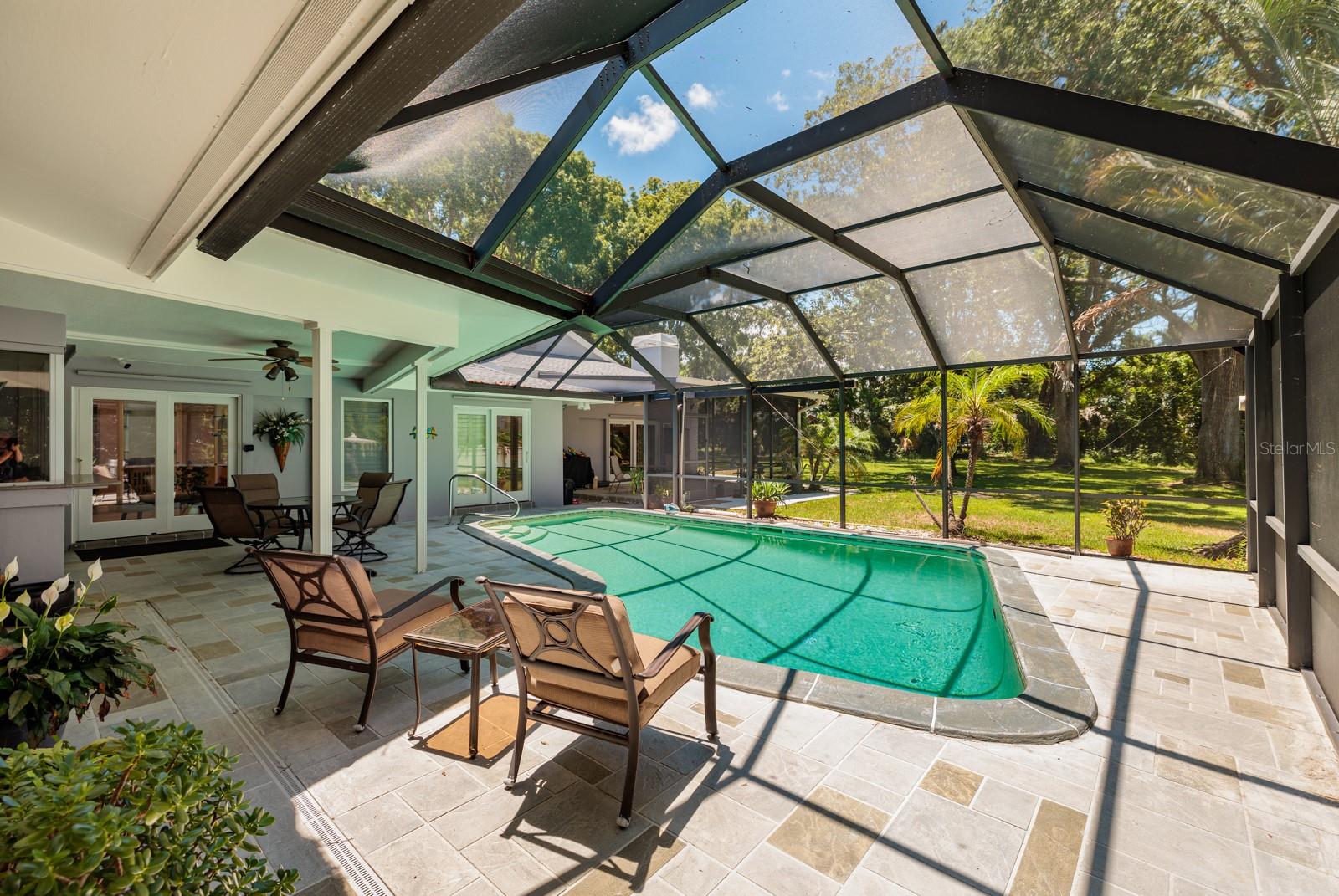 Pool Deck - view toward both Lanais and across the huge private yard.