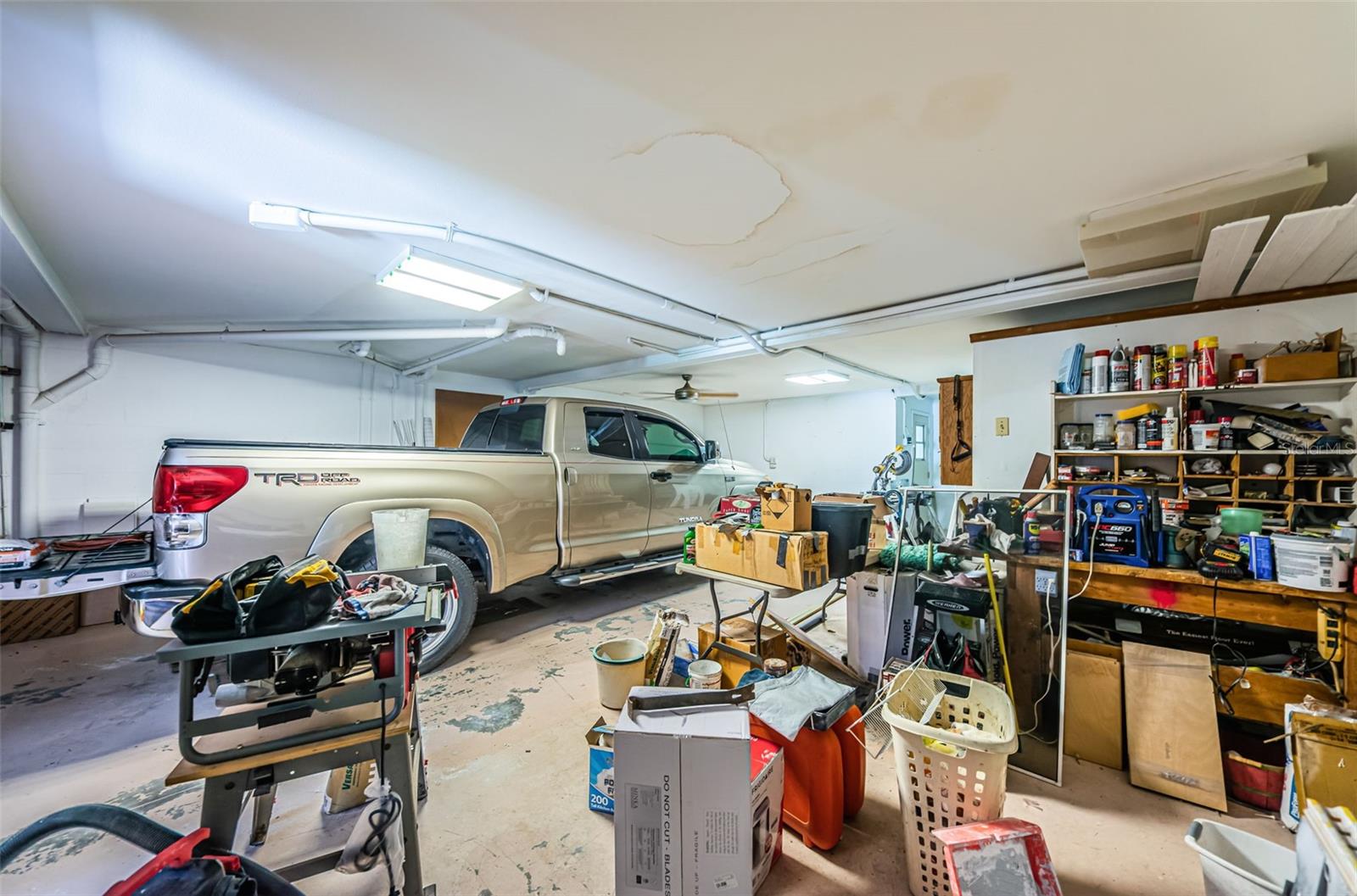 Three car garage with lots of space for a workshop.
