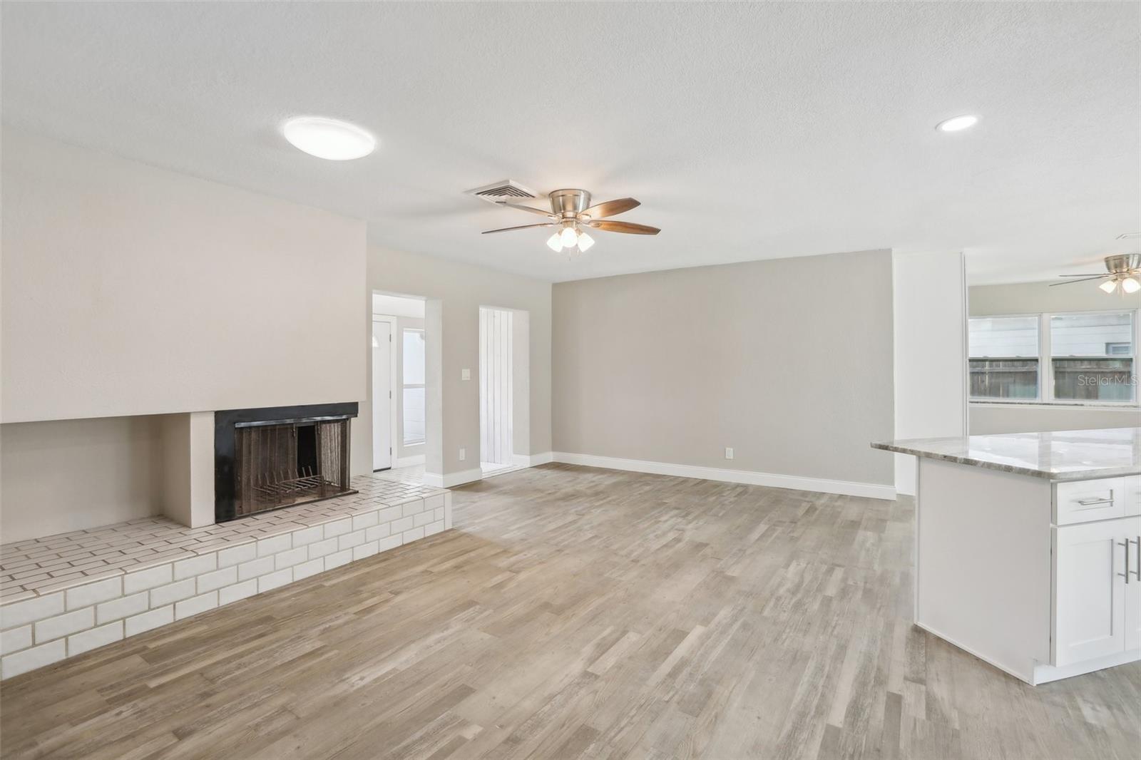 Another view of the living room and kitchen