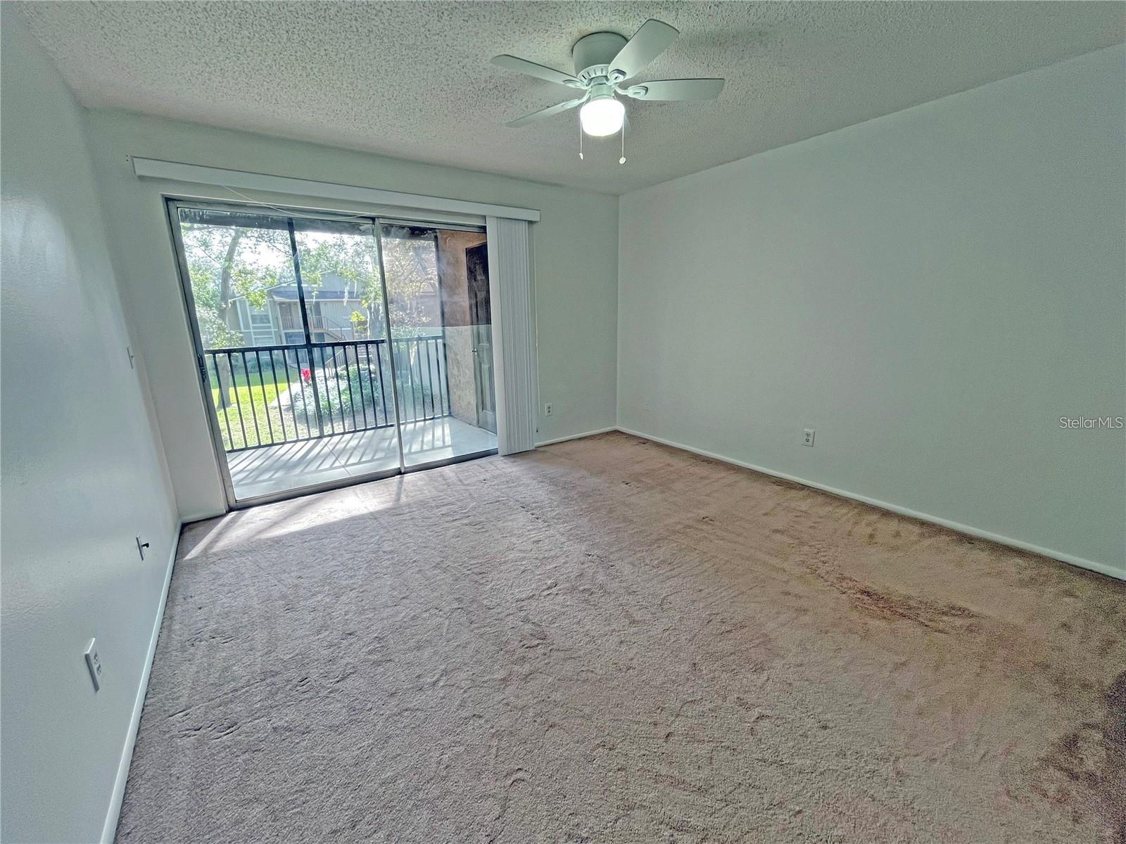 Primary Bedroom - Glass Sliders to Private Patio