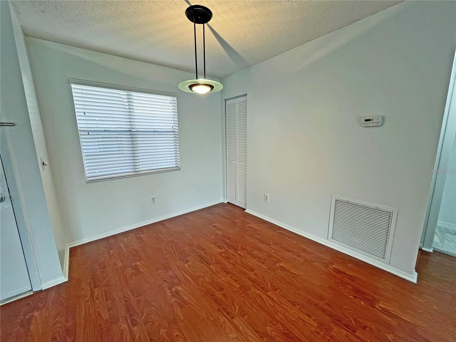 Dining Area - 12 x 10 - Laminate Floors and Coat Closet