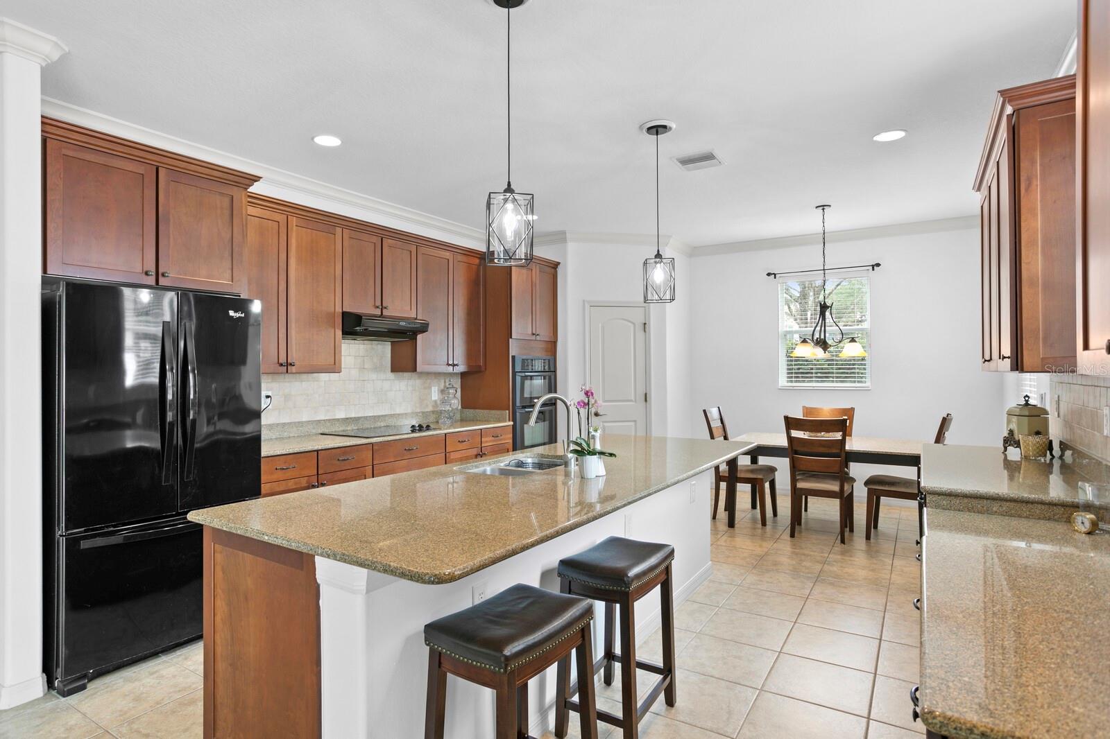 Granite counters and a French door refrigerator