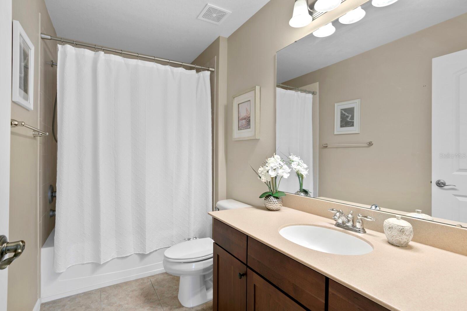 3rd full bath with a tub/shower combo shared by the 3rd & 4th bedrooms