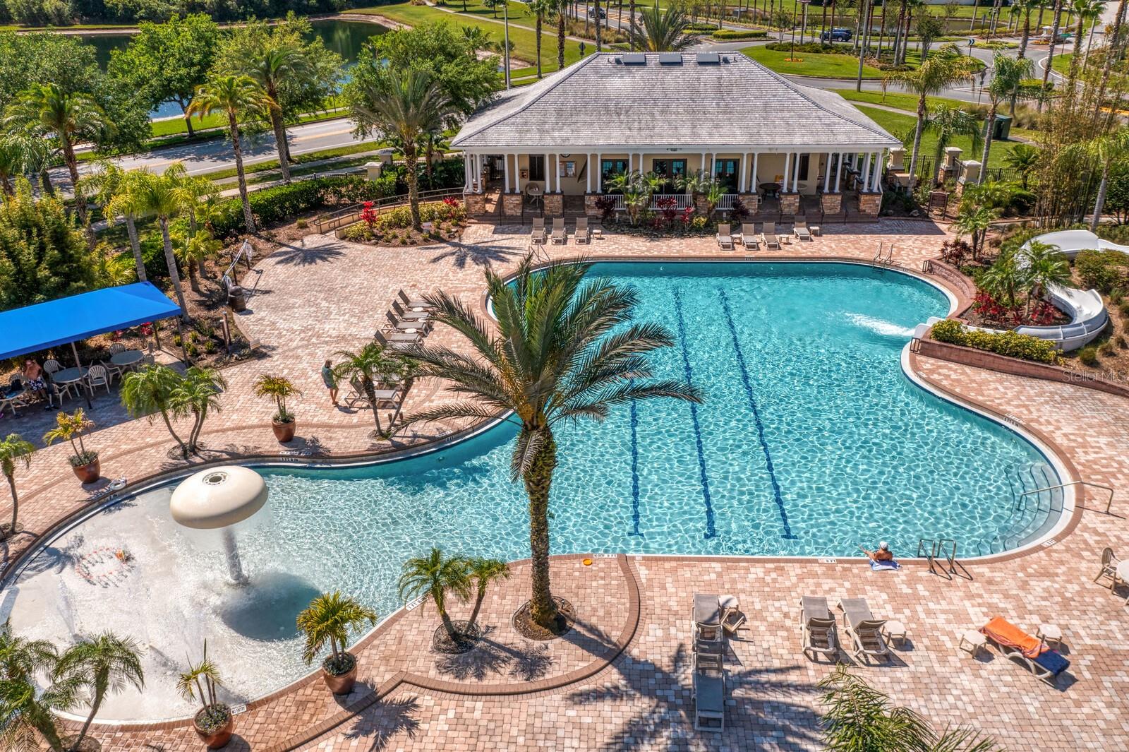 Expansive paver deck at community pool