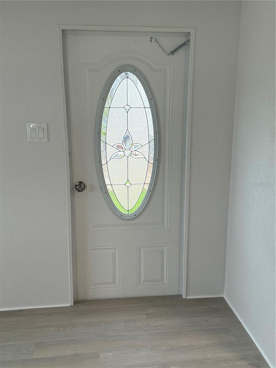 Architectural styel front door with oval window