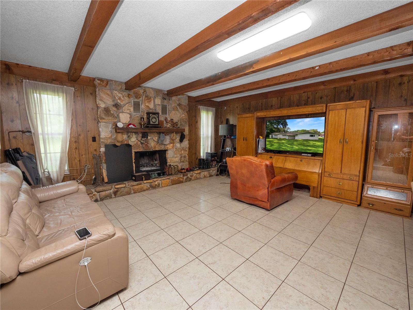 Left side of home living room  with fireplace