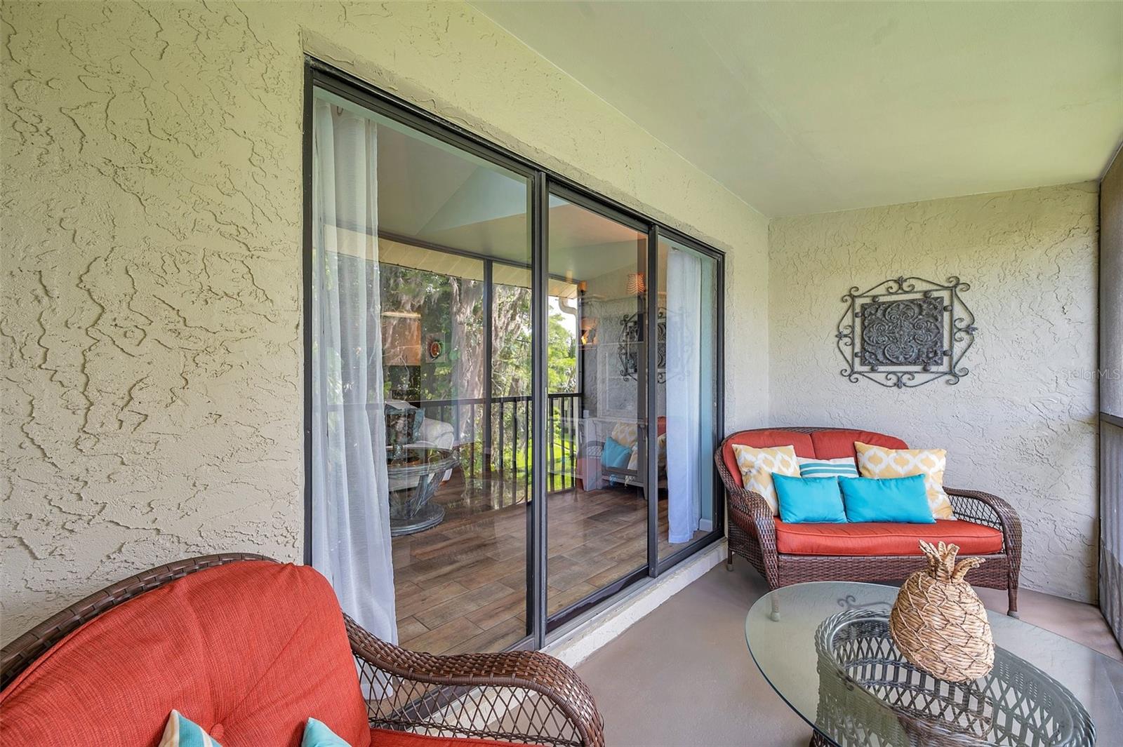 The living room leads you to your screened balcony