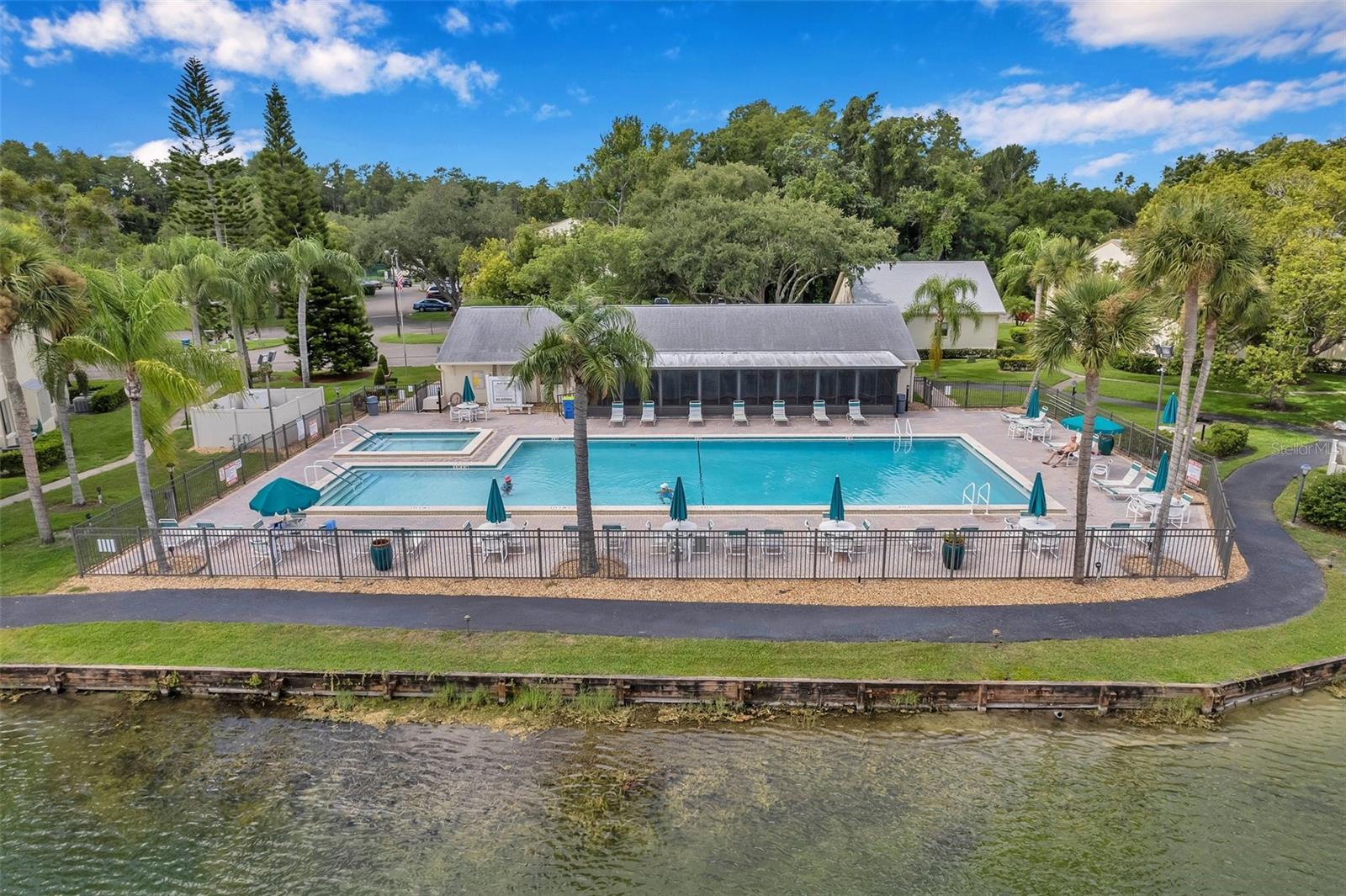 Community pool and walking path that leads you throughout the community of Pine Ridge