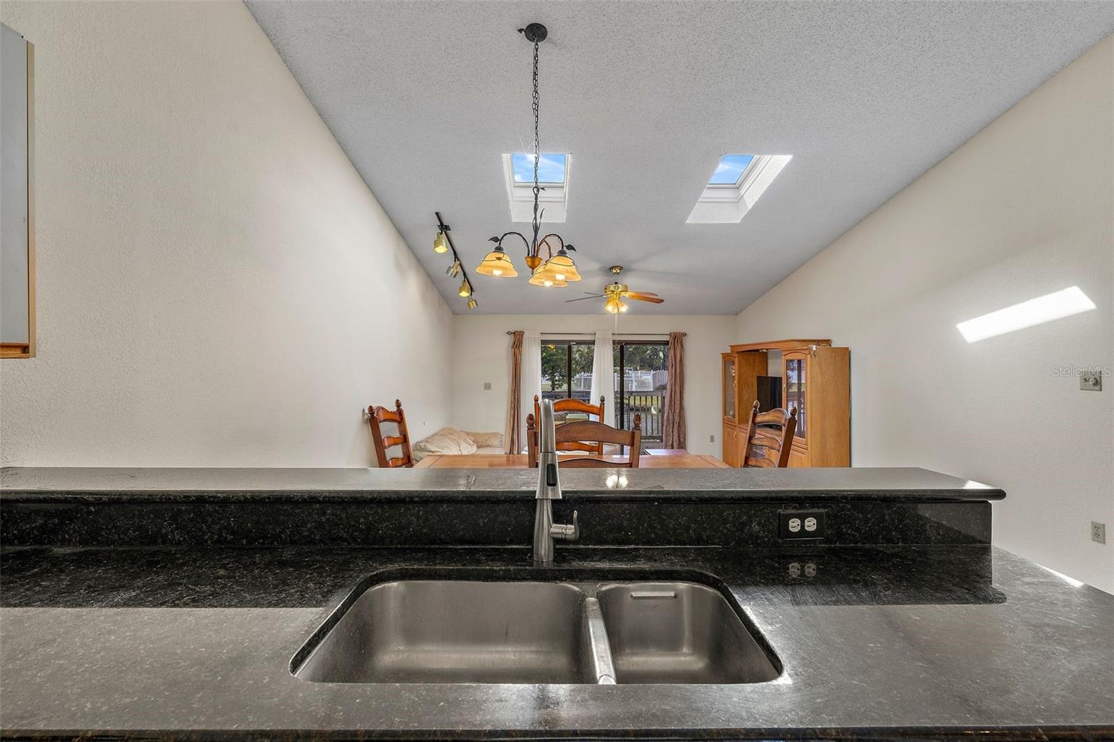 kitchen looking into living and dining rooms