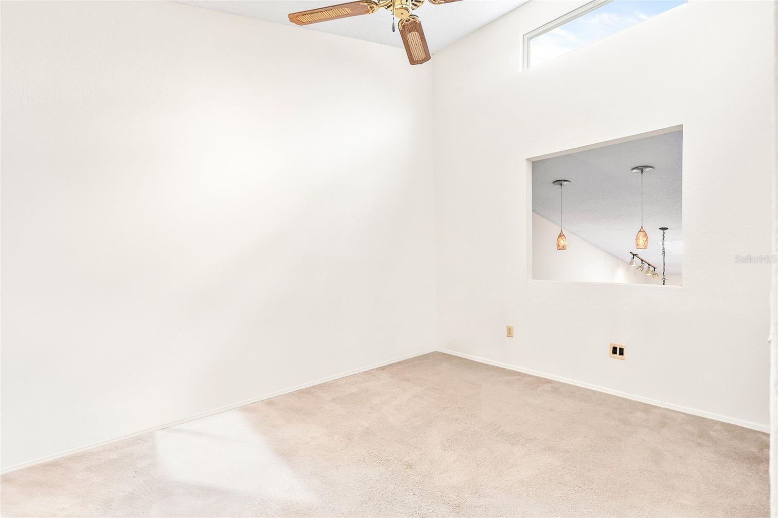 bedroom 2 with window looking over main living area for added natural light