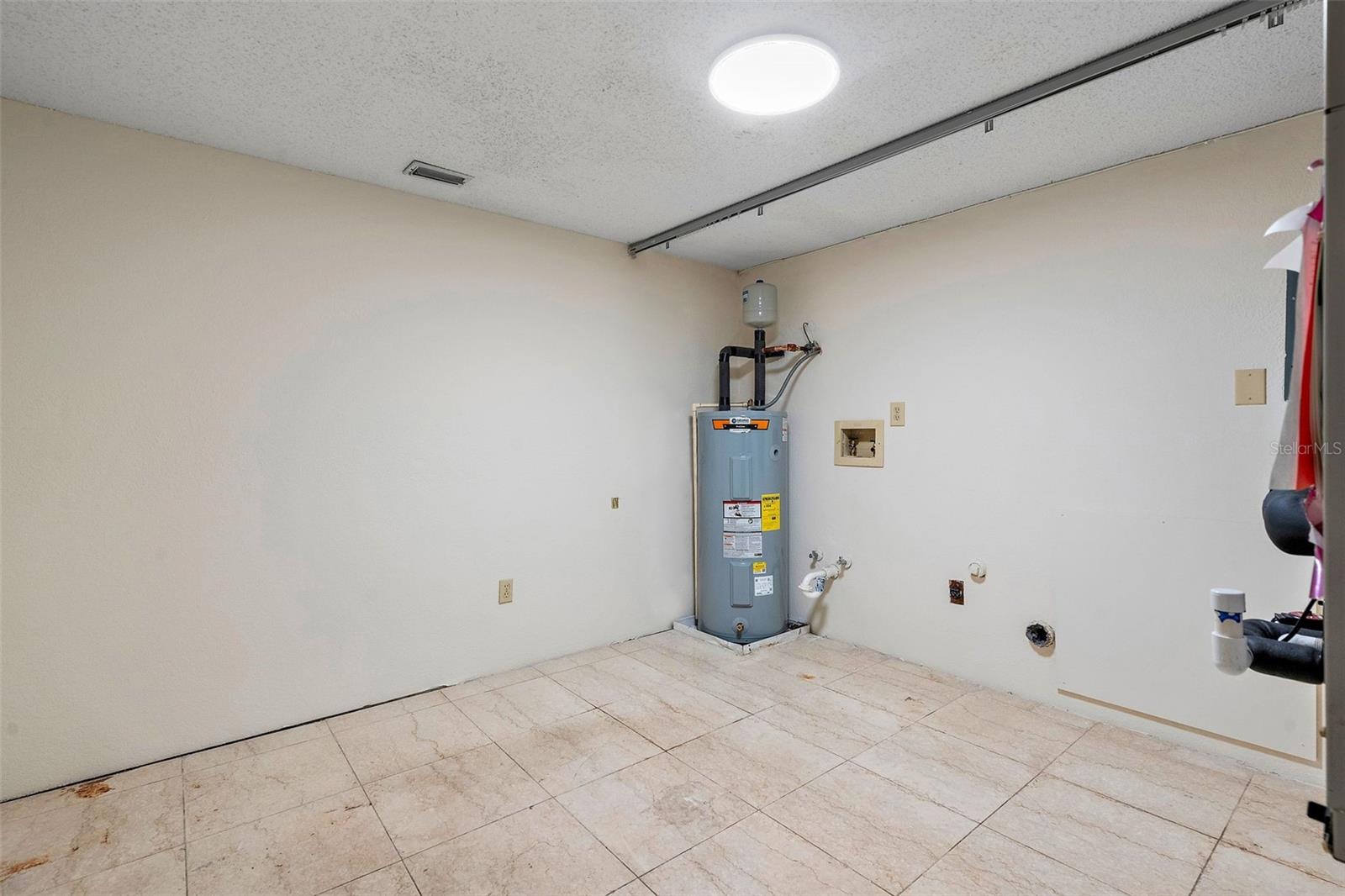 spacious laundry room on first level off entryway