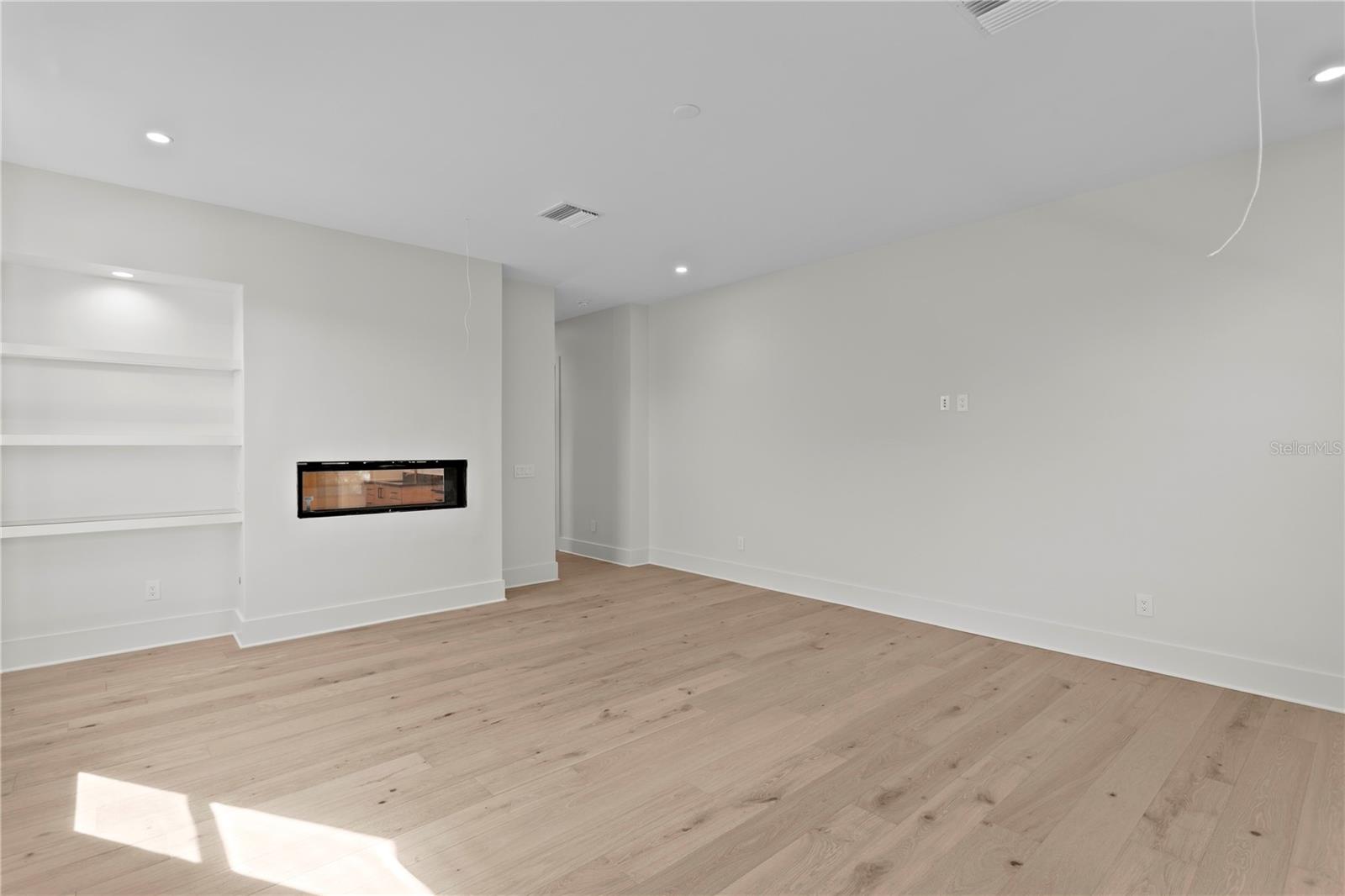 Dual sized fire place and built in