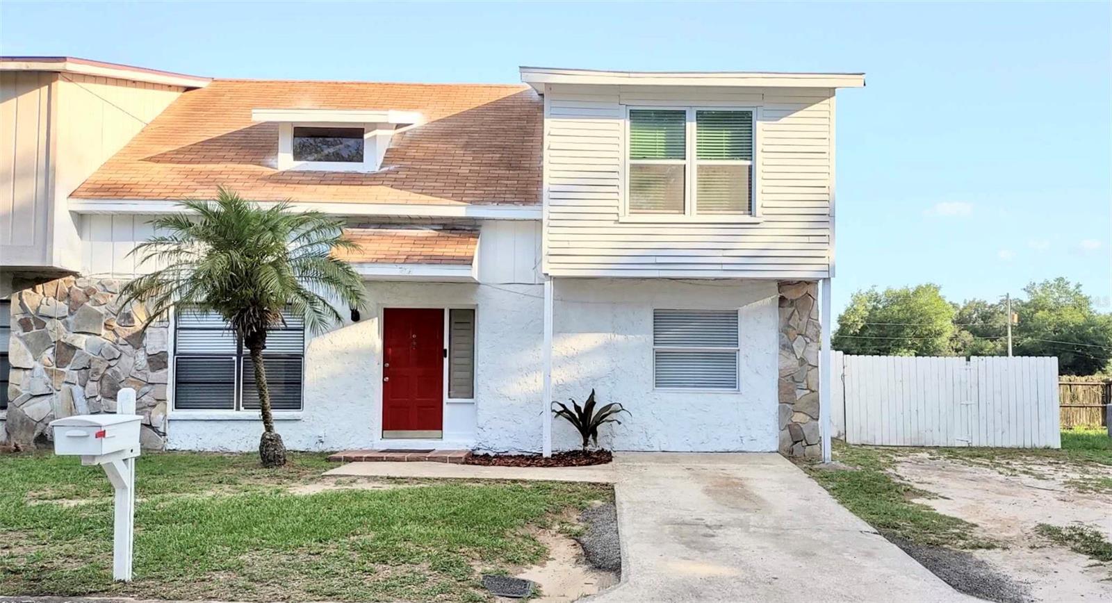 Front of the 4BR/2BA Townhouse with 2 Years Old Roof, Just Painted Outside of the whole house