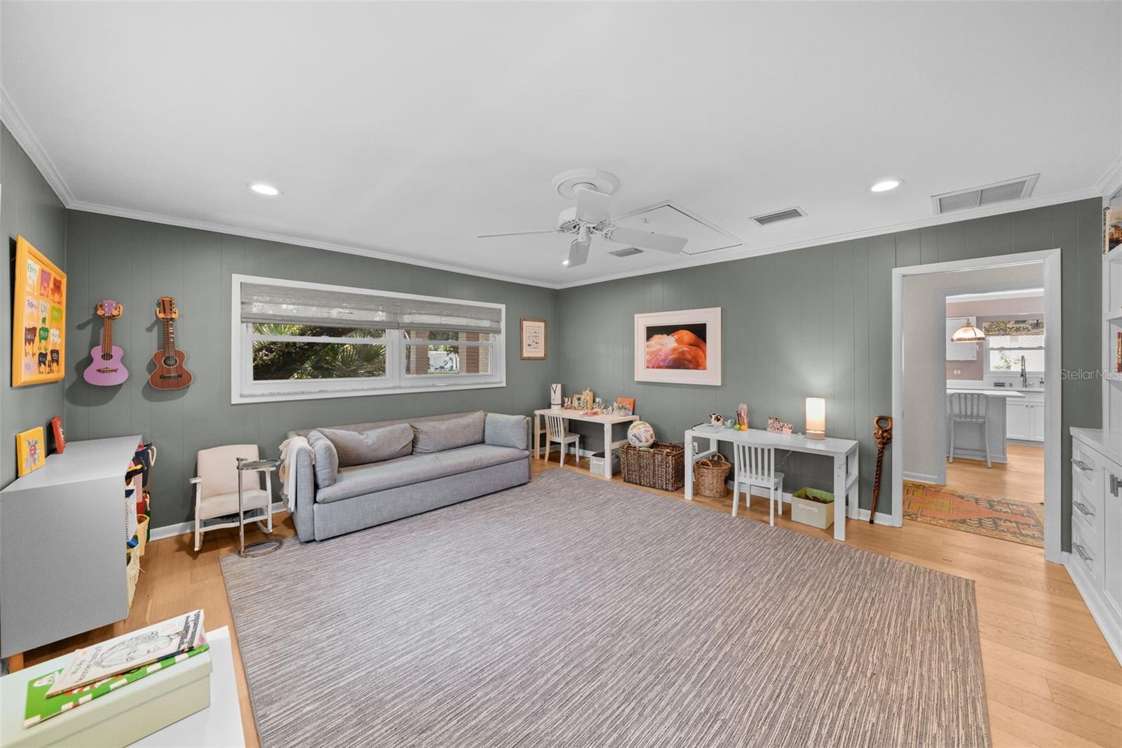 Bonus room is set apart from other living spaces off foyer