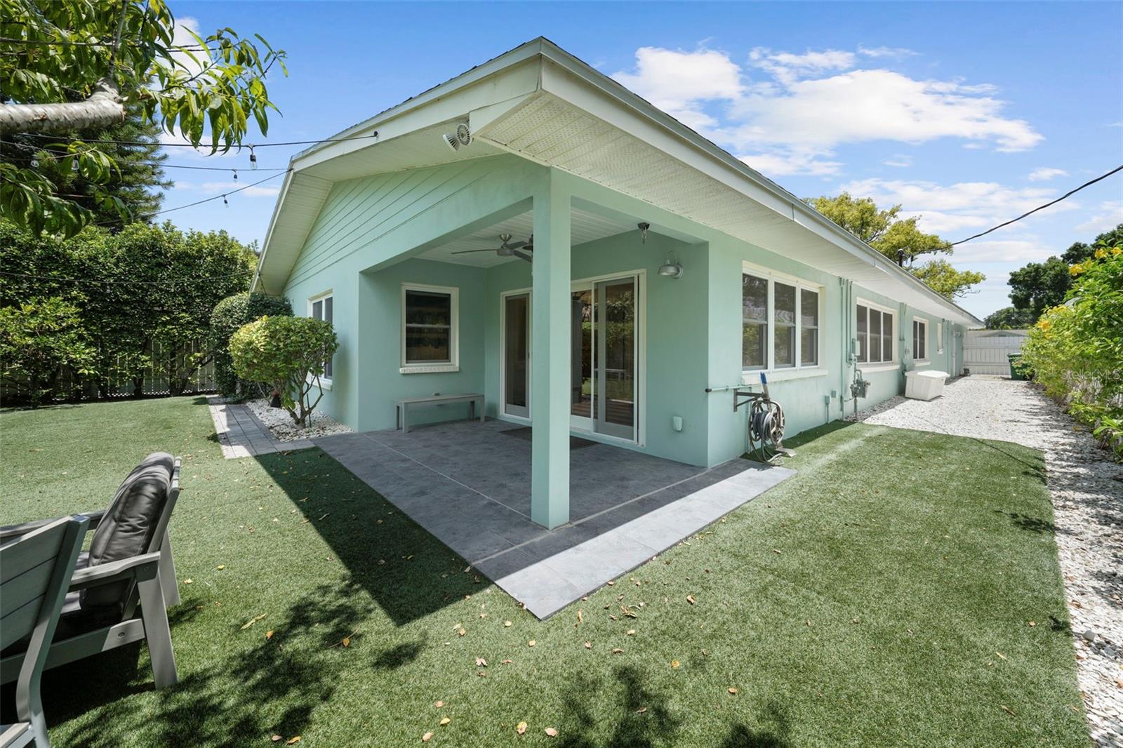 Covered patio and side yard with space for your golf cart