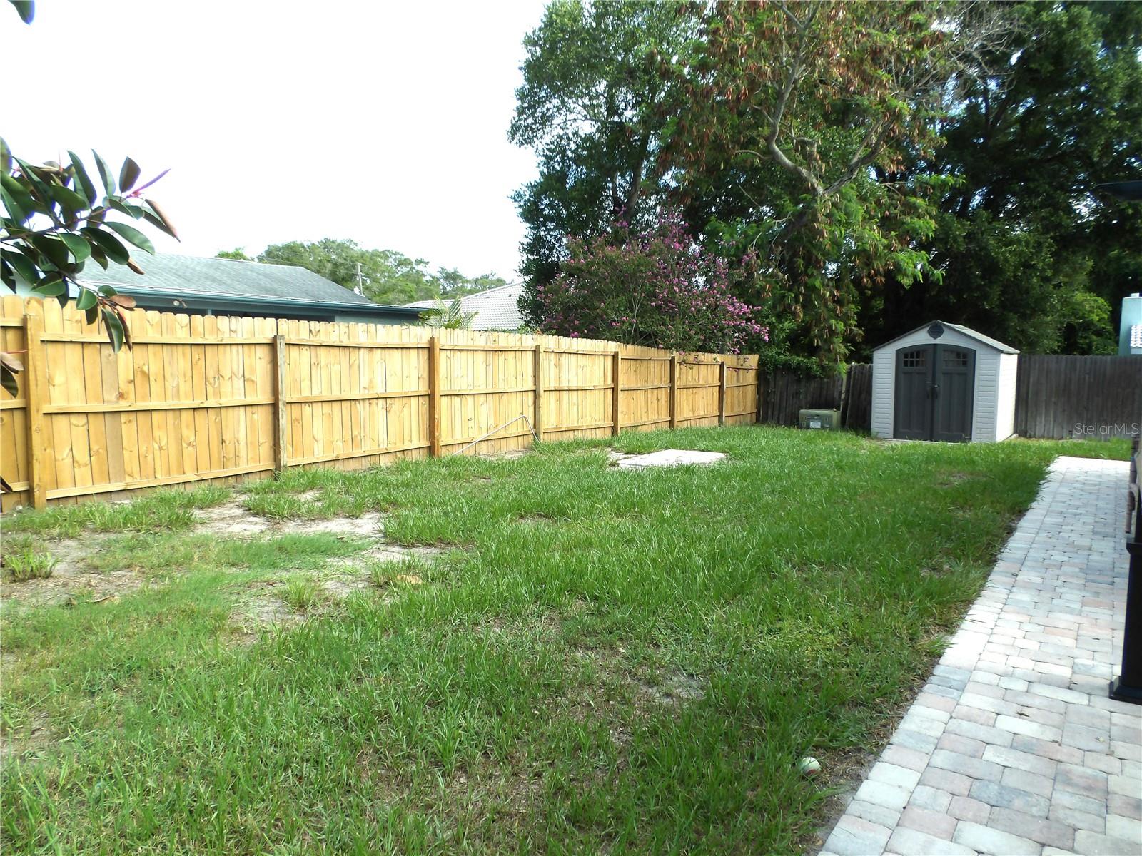 Fenced Backyard With Shed