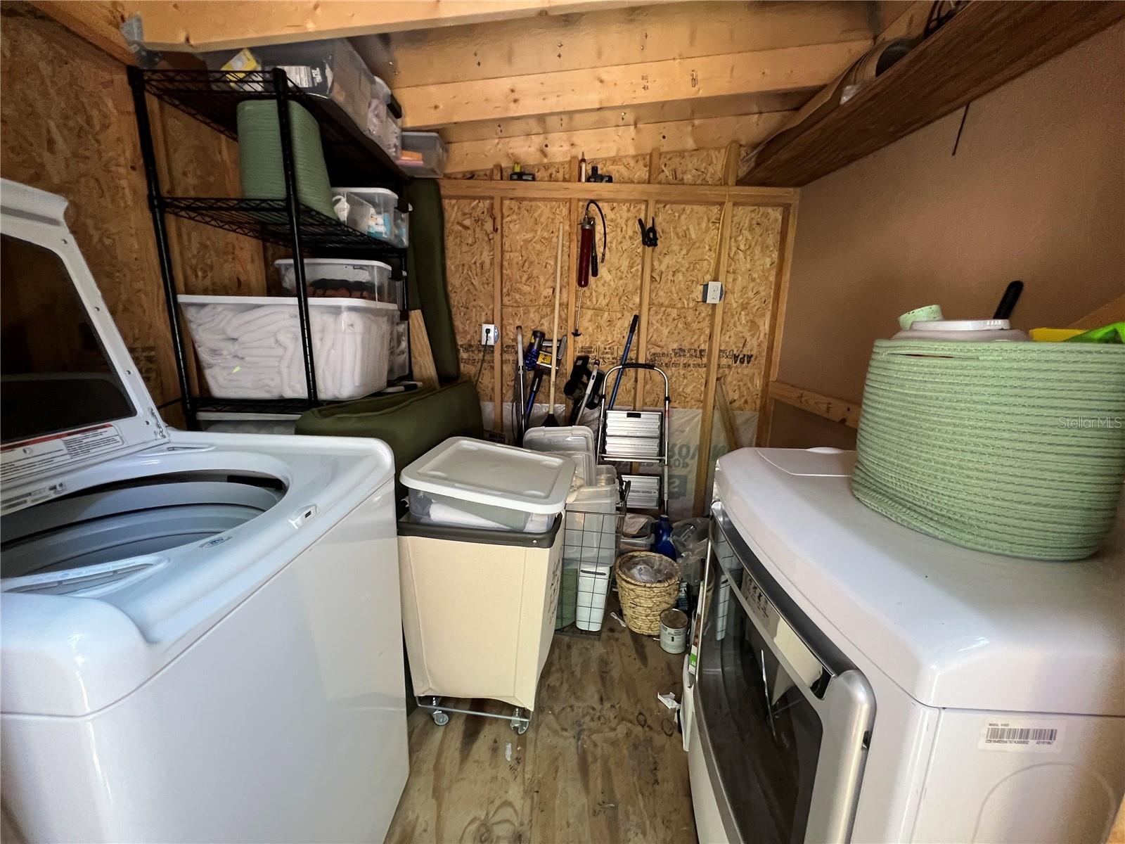 Attached shed with full size washer and dryer