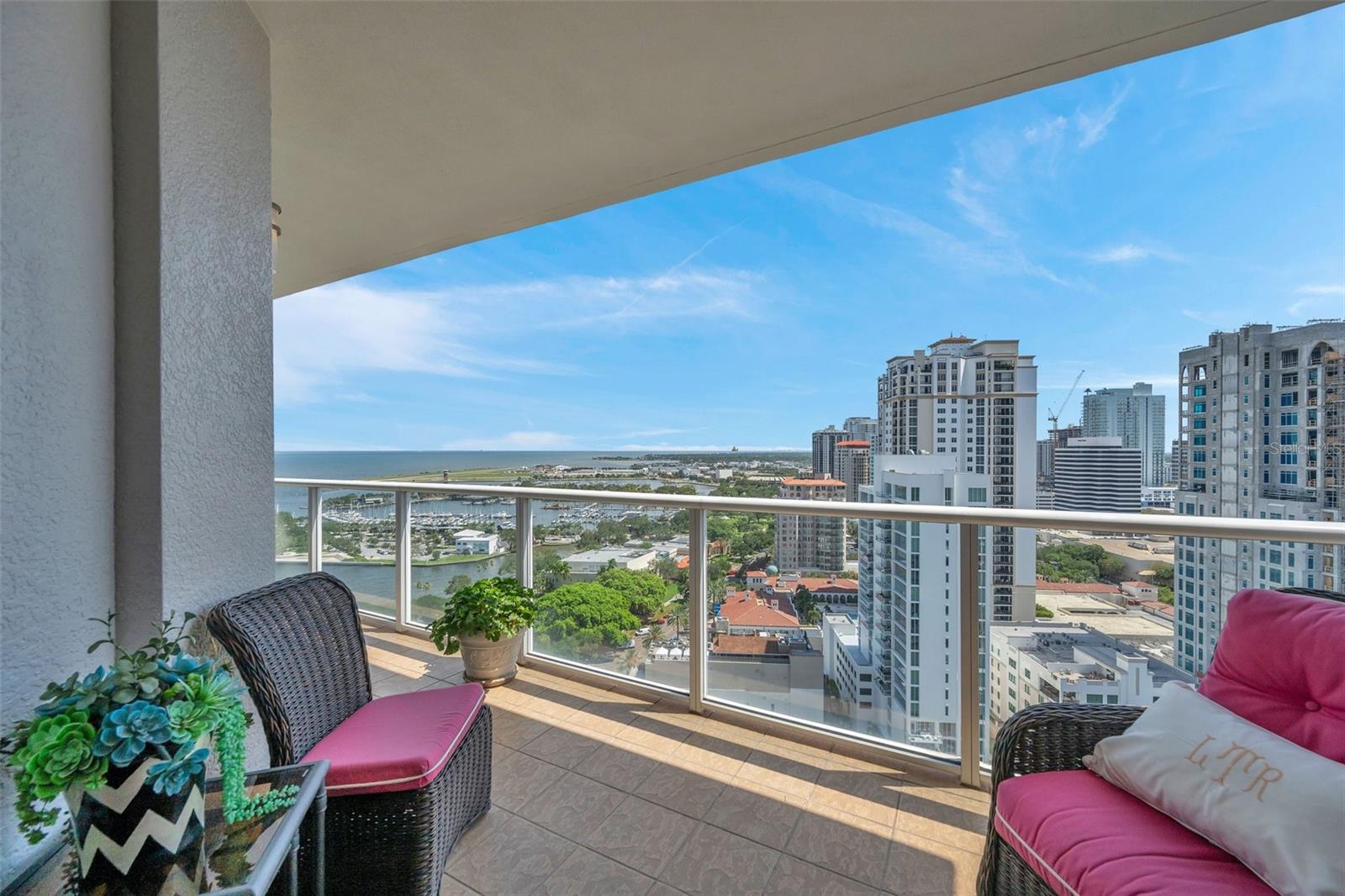 Relaxing city and water views from the covered balcony!