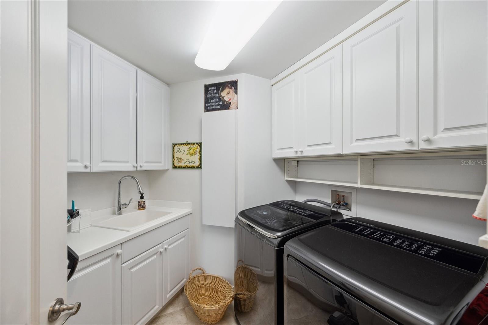 Detail of laundry room with plenty of storage, sink !