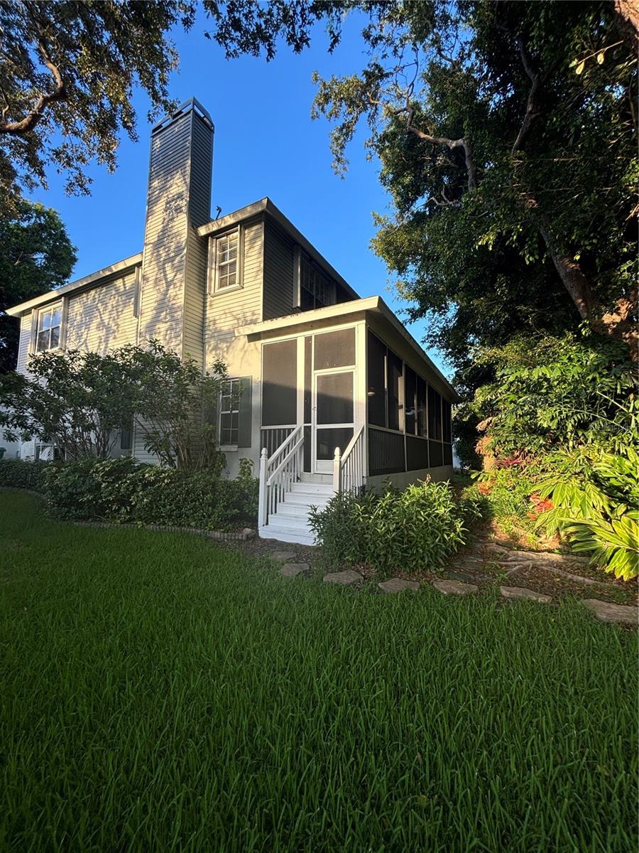 Backyard leading to porch.