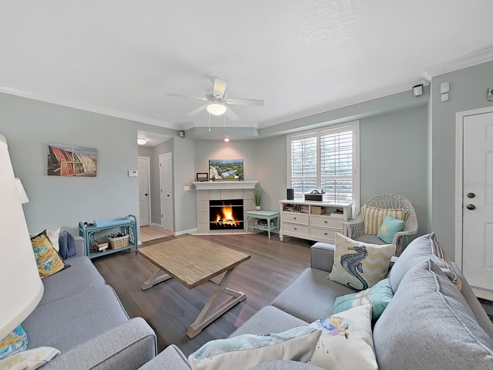 Living room w/ wood burning fire place