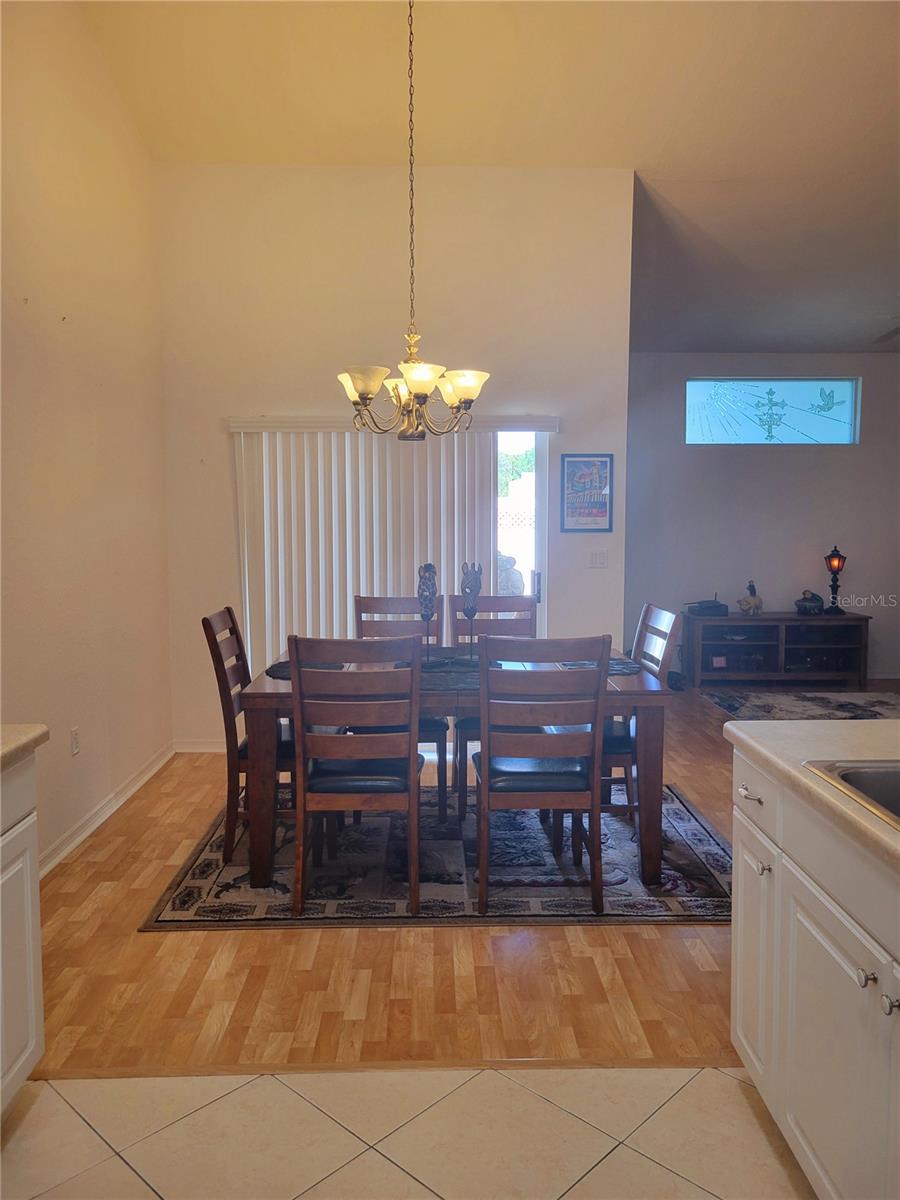 Dining Room space open to Sliders and Covered Lanai area