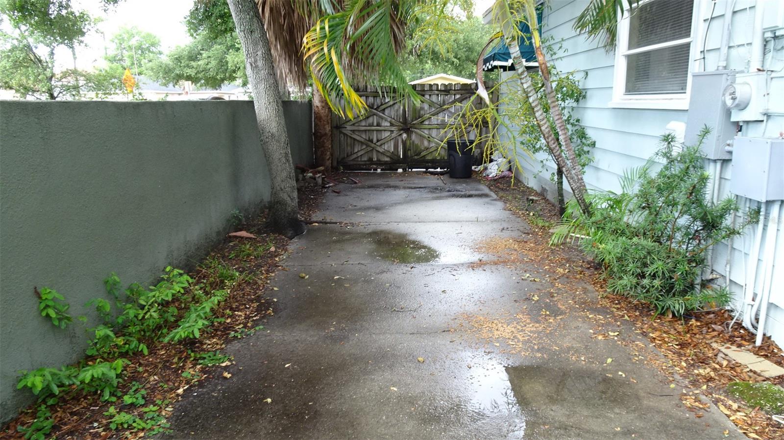 Parking behind the front fence on west side of house