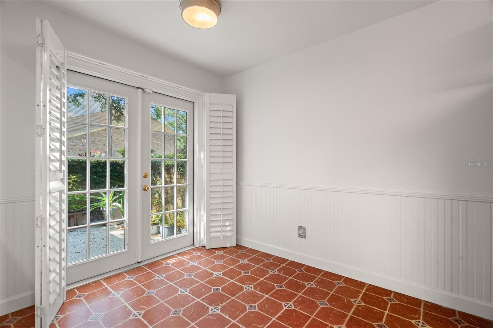 Breakfast nook with french doors leading out to front patio