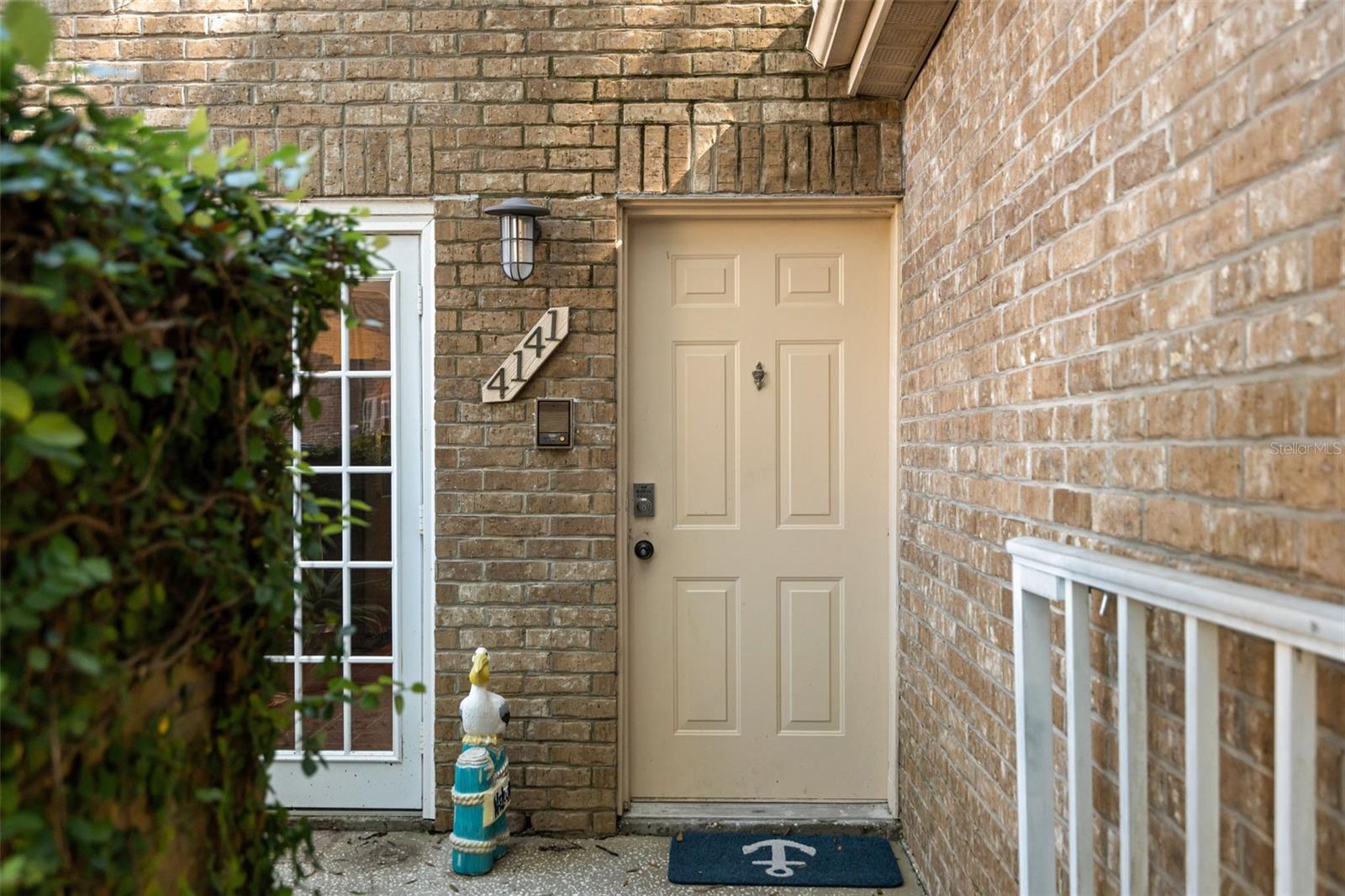 Beautiful stone Front, End Unit, with gated front patio and 1 car garage