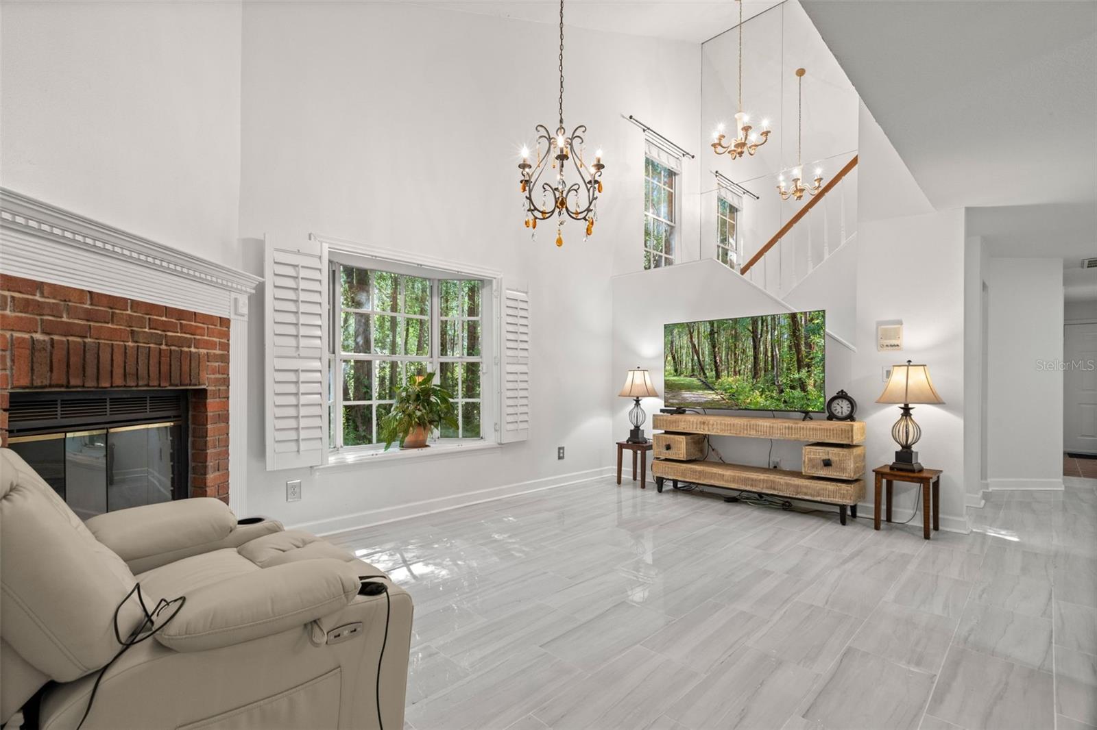 New Tile in Large Living Room with Cathedral Ceilings and lots of light