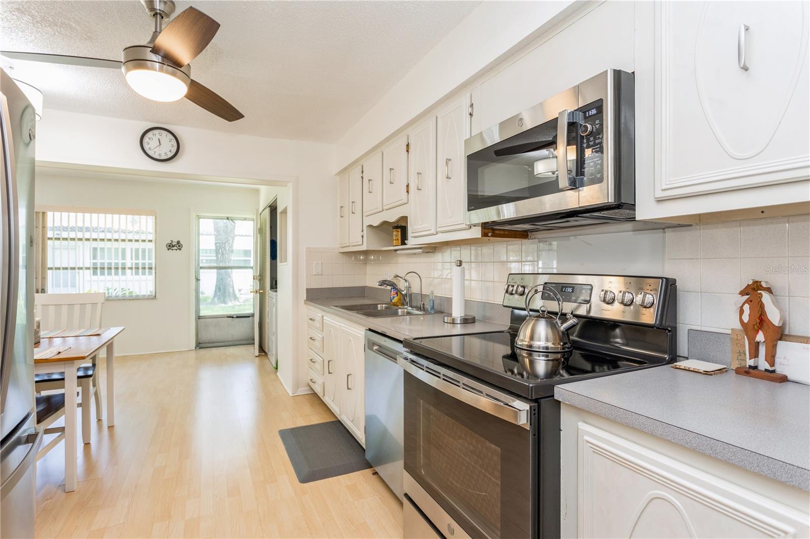 Entrance to kitchen leads to back green space in the rear of the unit.