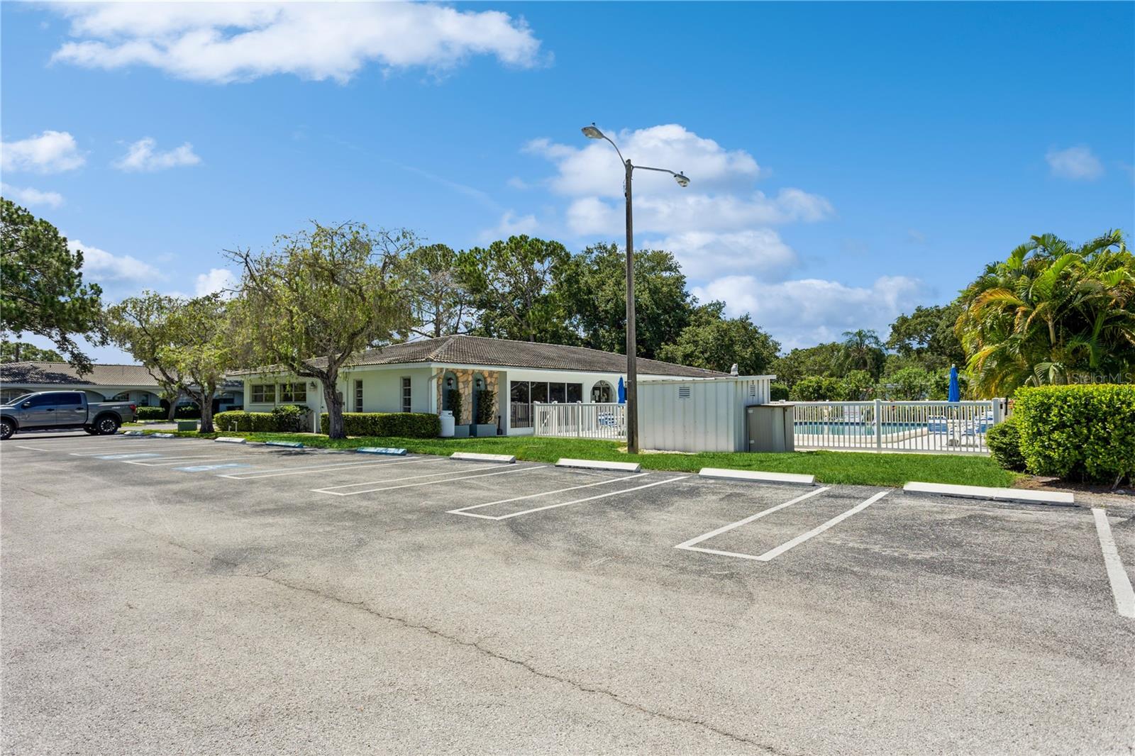 Twin Oaks clubhouse with Guest parking.