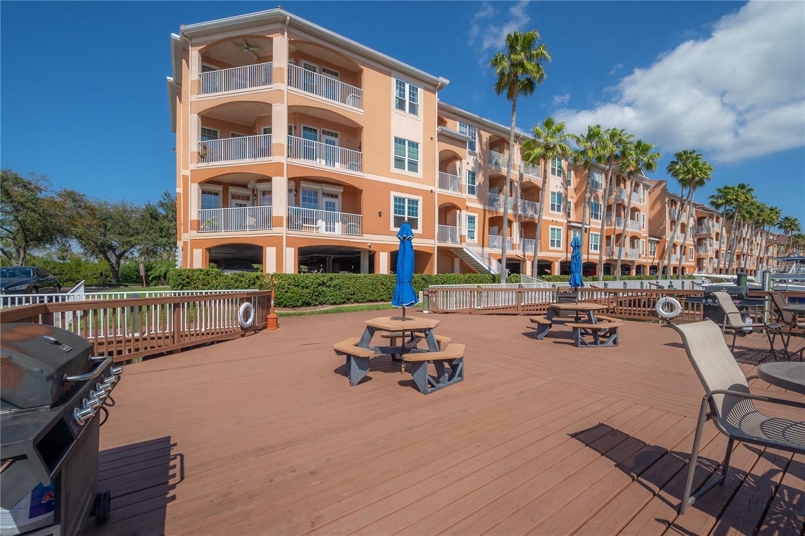 Seating/grill area along marina boardwalk