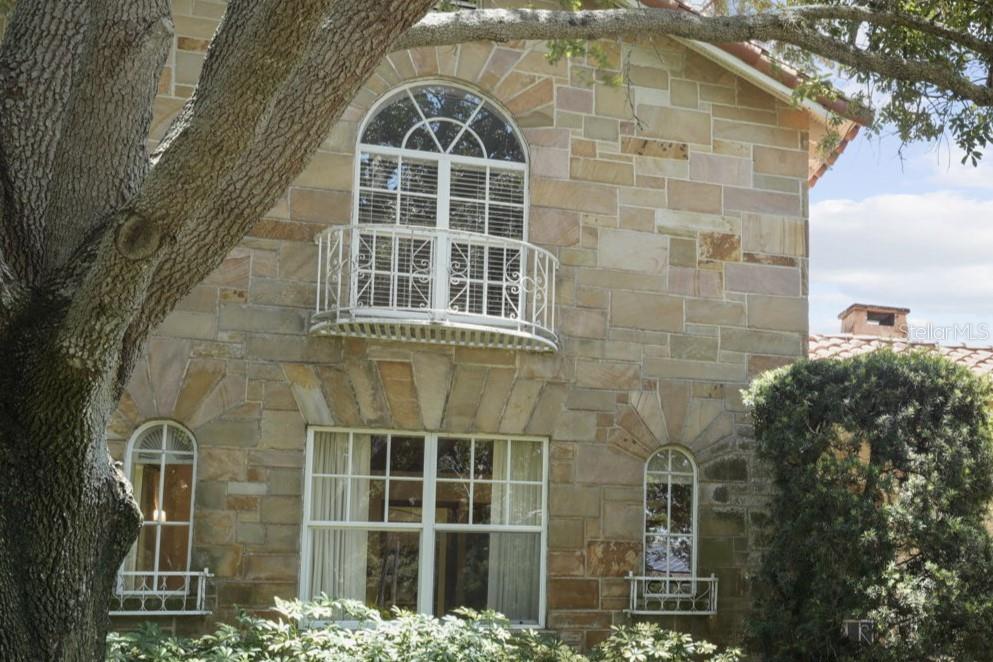 Arched Windows and Coin Balconies