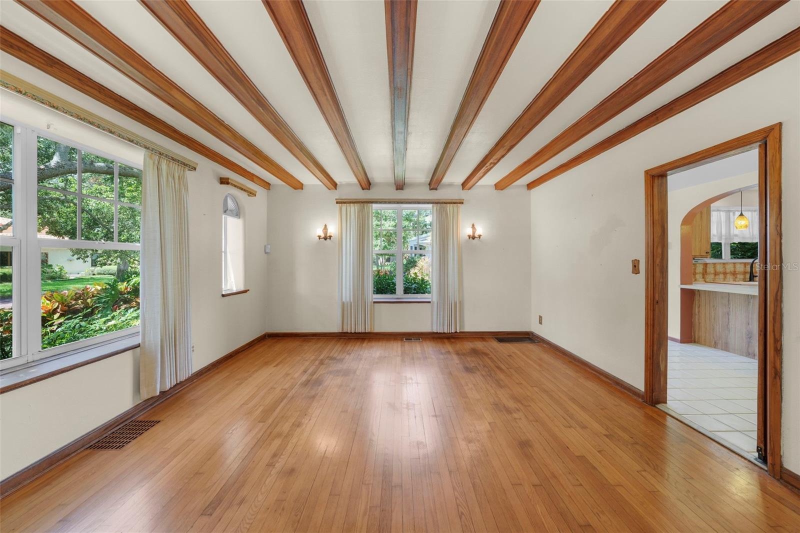 Dining room with wood beam ceiling