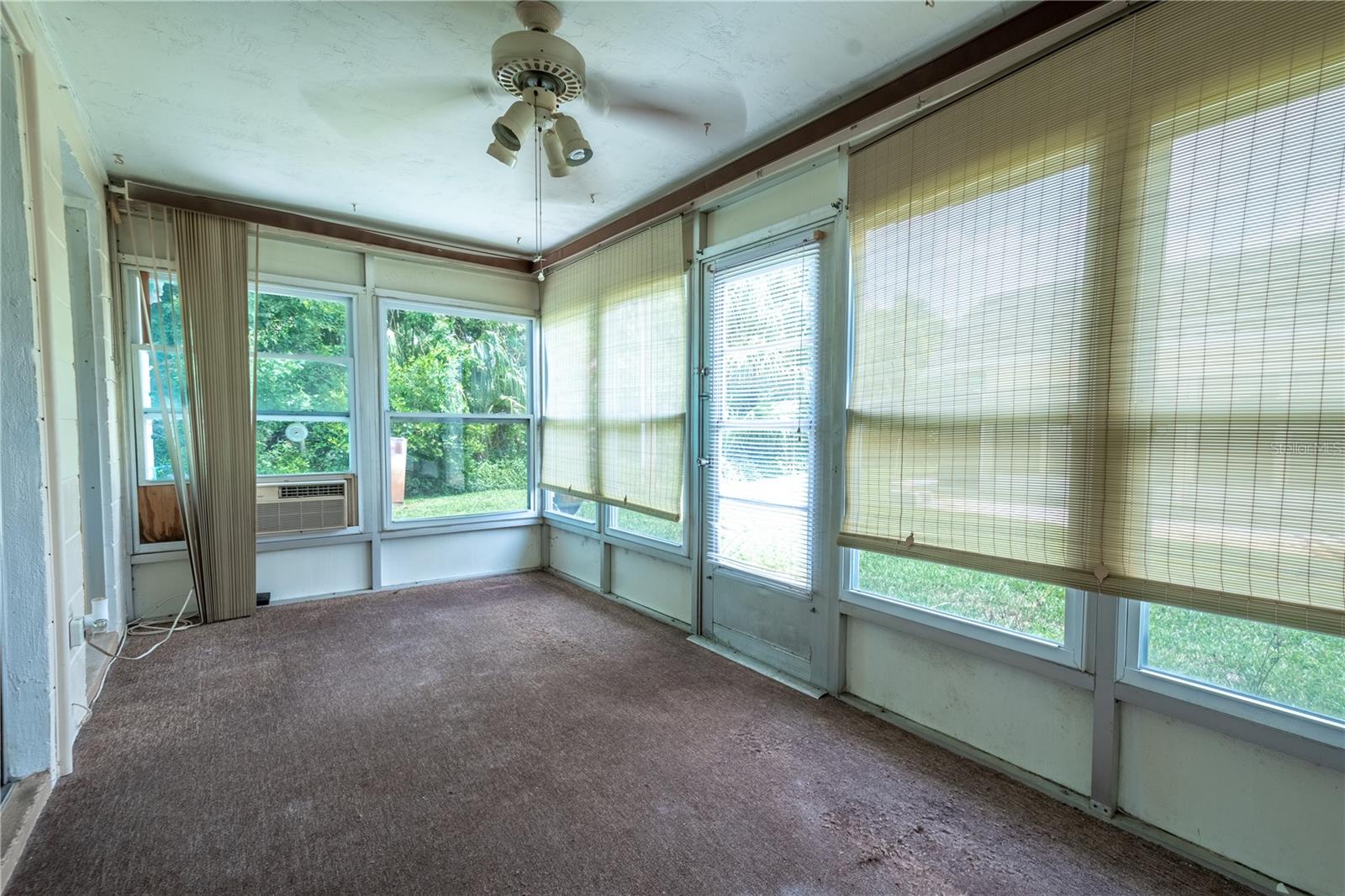 The Florida room is wall to wall windows bringing the outdoors in.