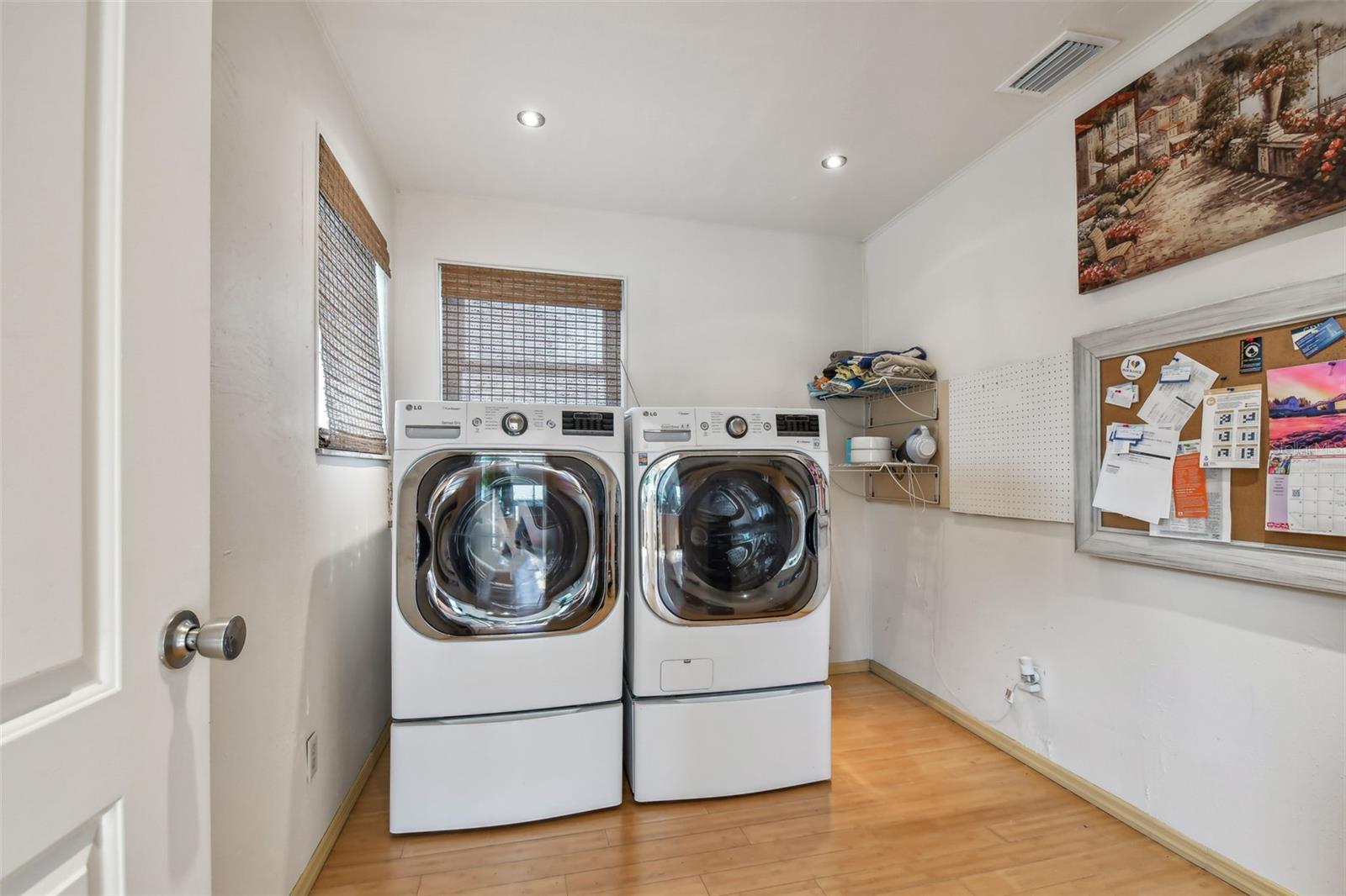 Large laundry room with plenty of additional storage space