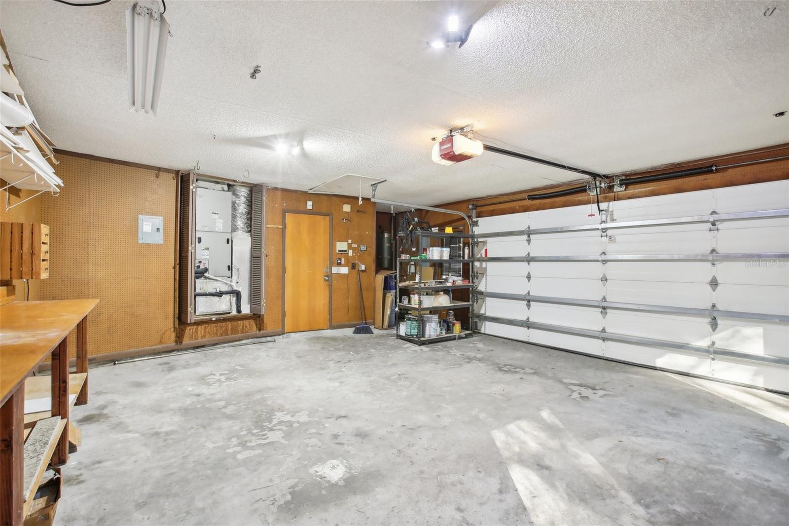 Garage with built in shelves, electrical and AC