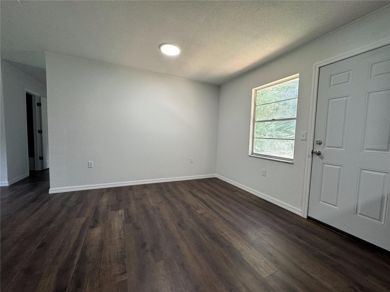 Living Room/ Dining Room/ Open Space - Door to Backyard