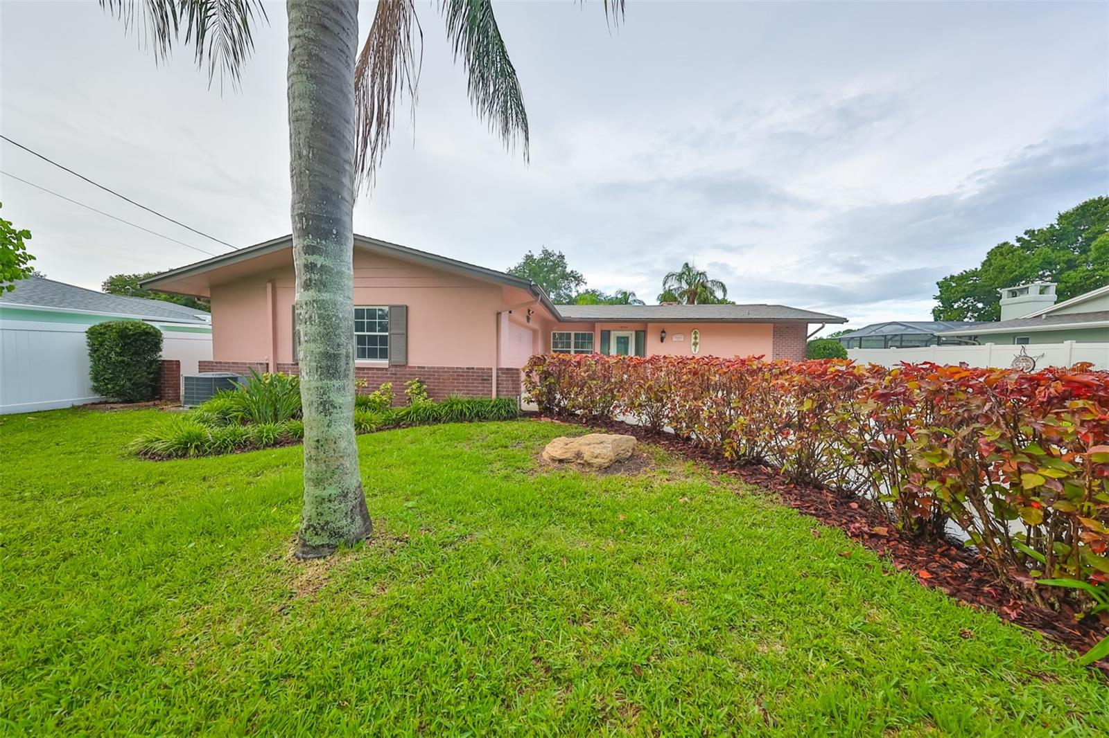 Beautifully Landscaped Home with Long Curving Driveway.